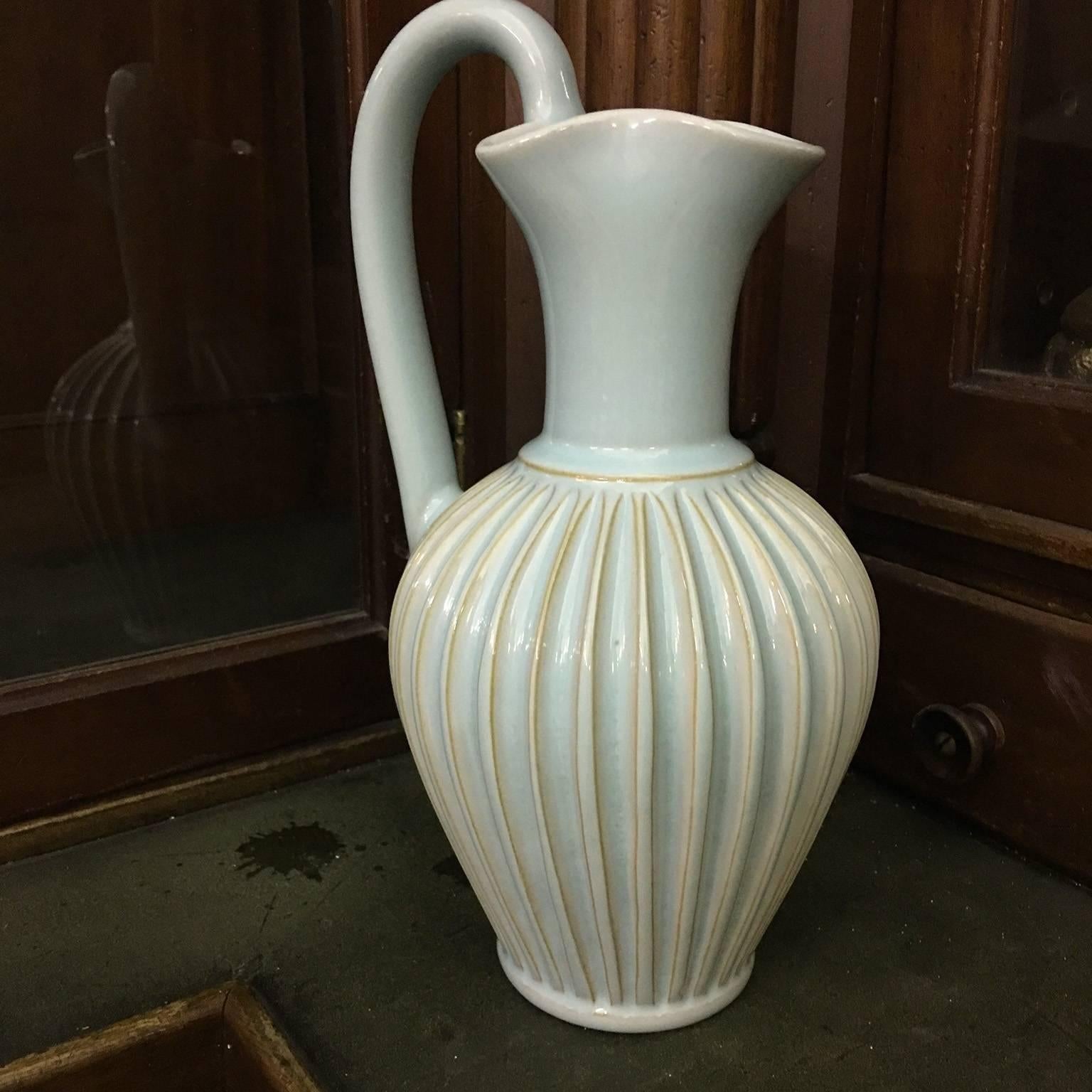 Light green pitcher by Eslau in really good condition
No nags.
  