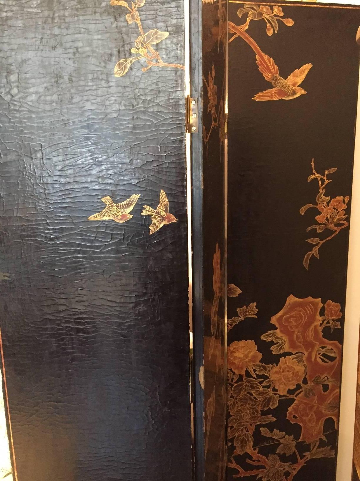 Six panel wallpaper screen hand-painted lacquered in black and gilded.