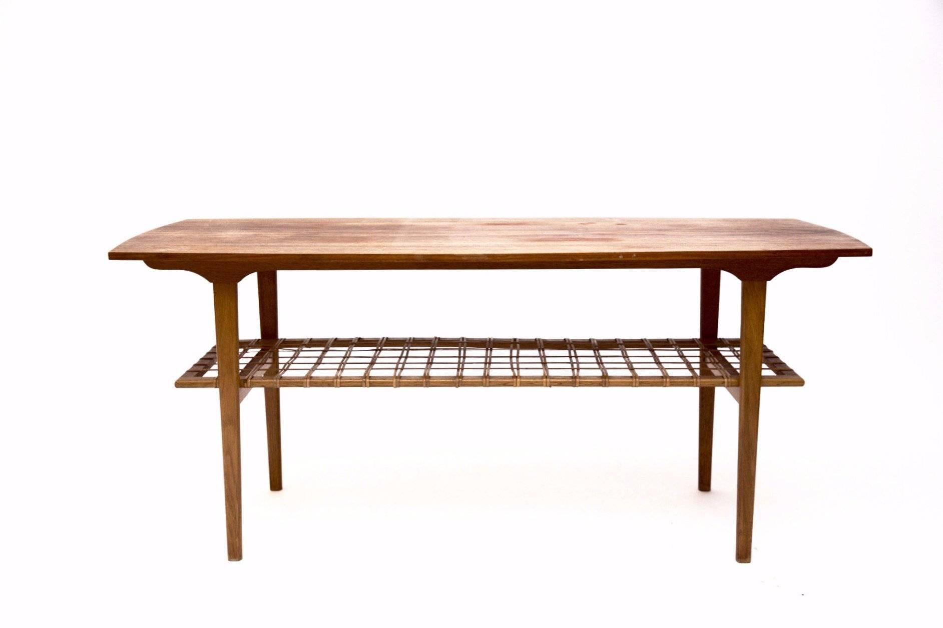 This coffee table with a string shelf would be a wonderful addition to your living room.

Designed in Denmark, 1960s.