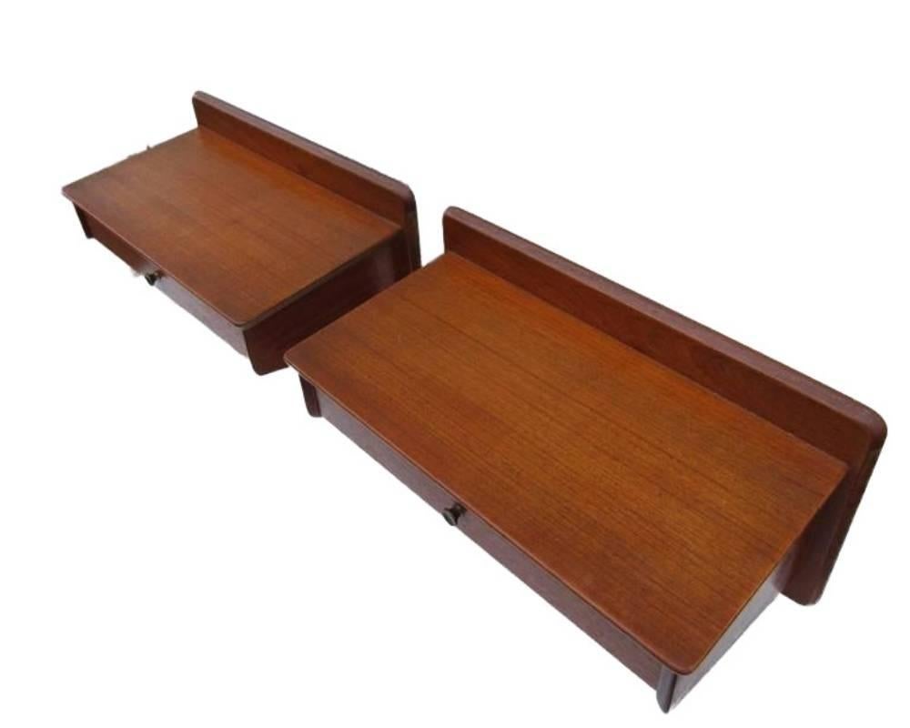 This pair of Mid-Century Modern wall hanged night tables in teak designed by Gunni Omann for Oman Jun in Denmark is a rare sight today. They come with a little drawer and a nice, simple design.

  