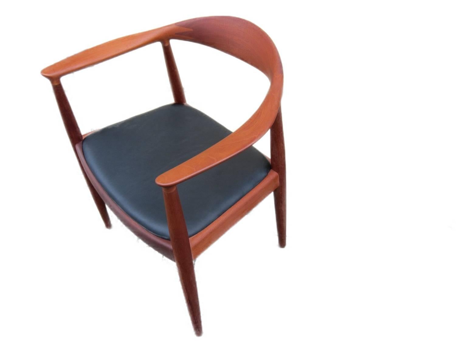 This round chair, Model JH-503 ("The Chair") comes with frames in mahogany and original black leather seats. It was manufactured at Fredericia Furniture.

This specific model of the chair is not in production anymore.