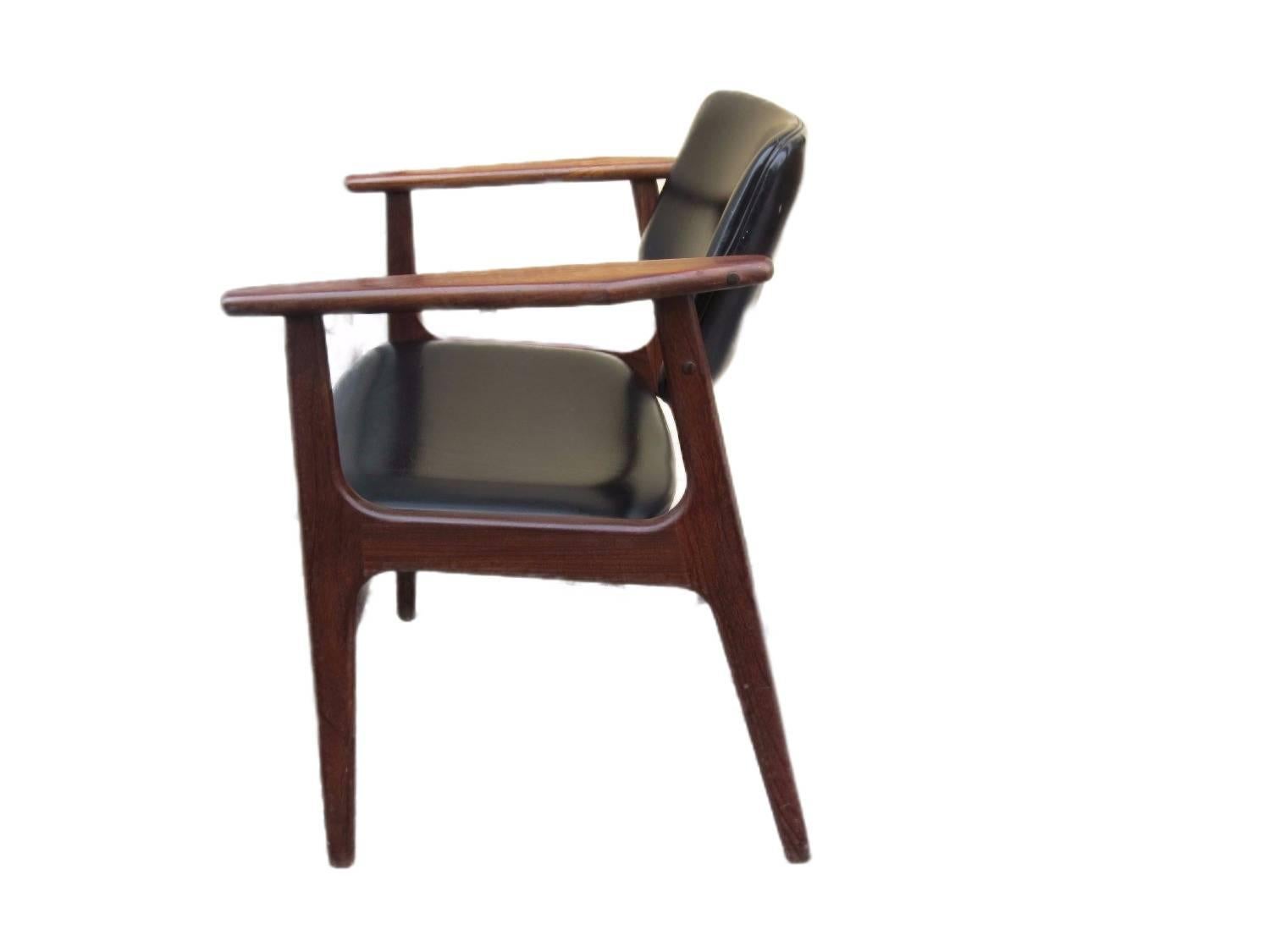 Lovely Danish Mid-Century teak armchair. The seat and backrest have been re-upholstered with black imitation leather. This is a very pleasing chair both for your eye and for your back.

It is produced in Denmark in the 1960s.