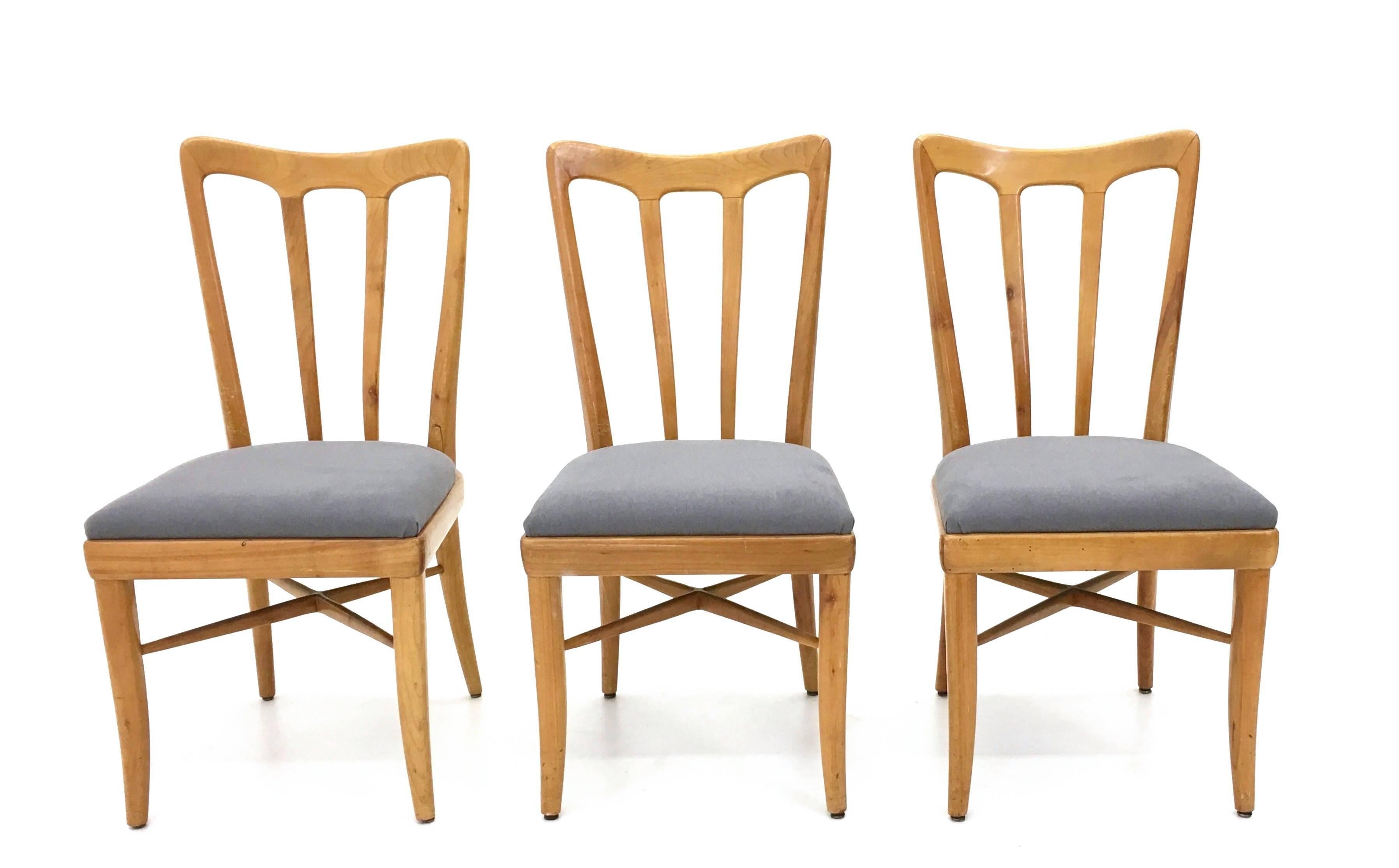 They are made in cherry and upholstered in grey fabric. 
These chairs are designed in the style of Guglielmo Ulrich.
They may show slight traces of use since they're vintage, but they can be considered as in excellent original condition and ready