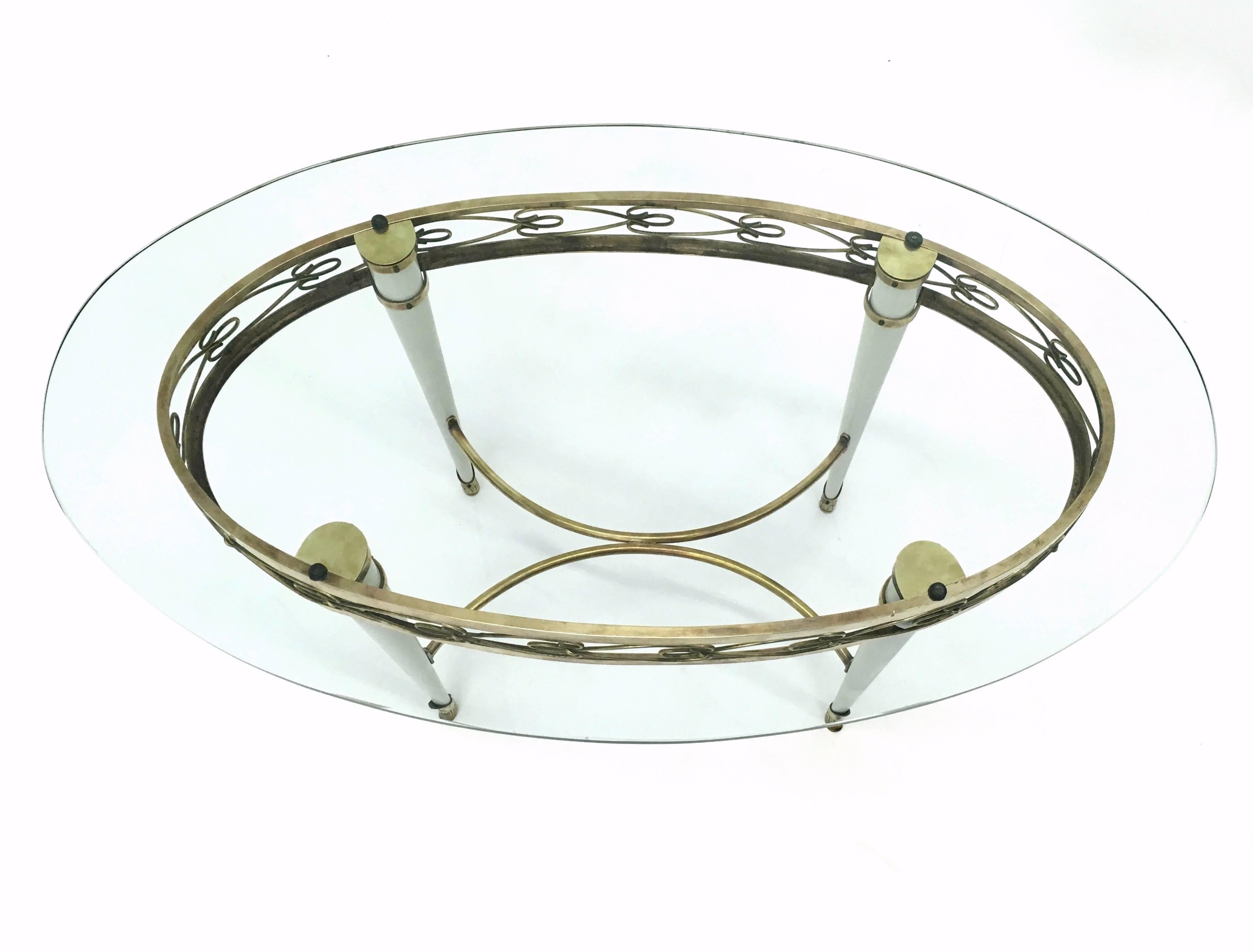 Mid-20th Century Brass Coffee Table with an Oval Glass Top in the Style of Pierluigi Colli, Italy For Sale