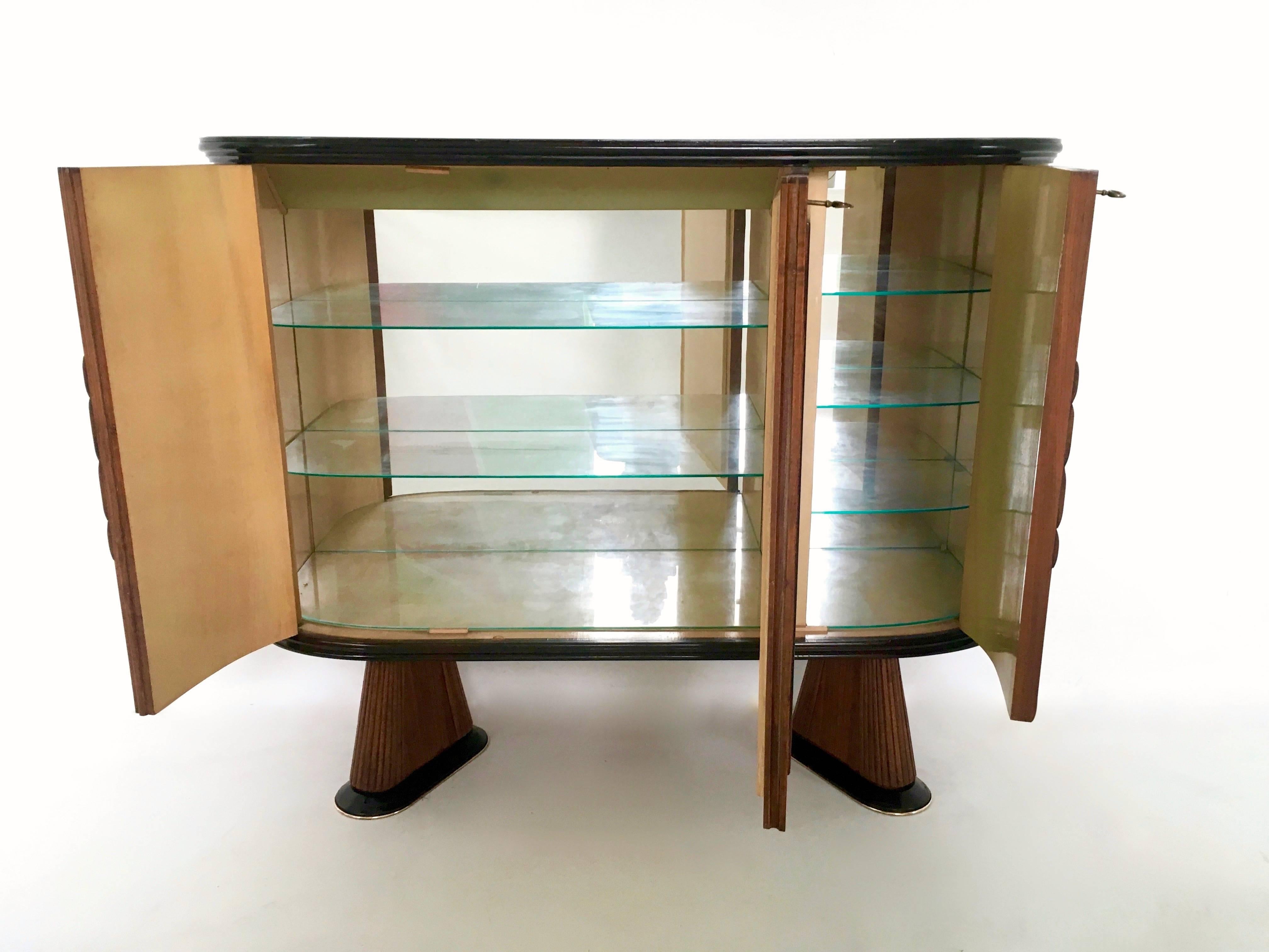 Made in wood, blue mirror, glass and brass. The interiors are made from maple and mirrors. 
In excellent condition.