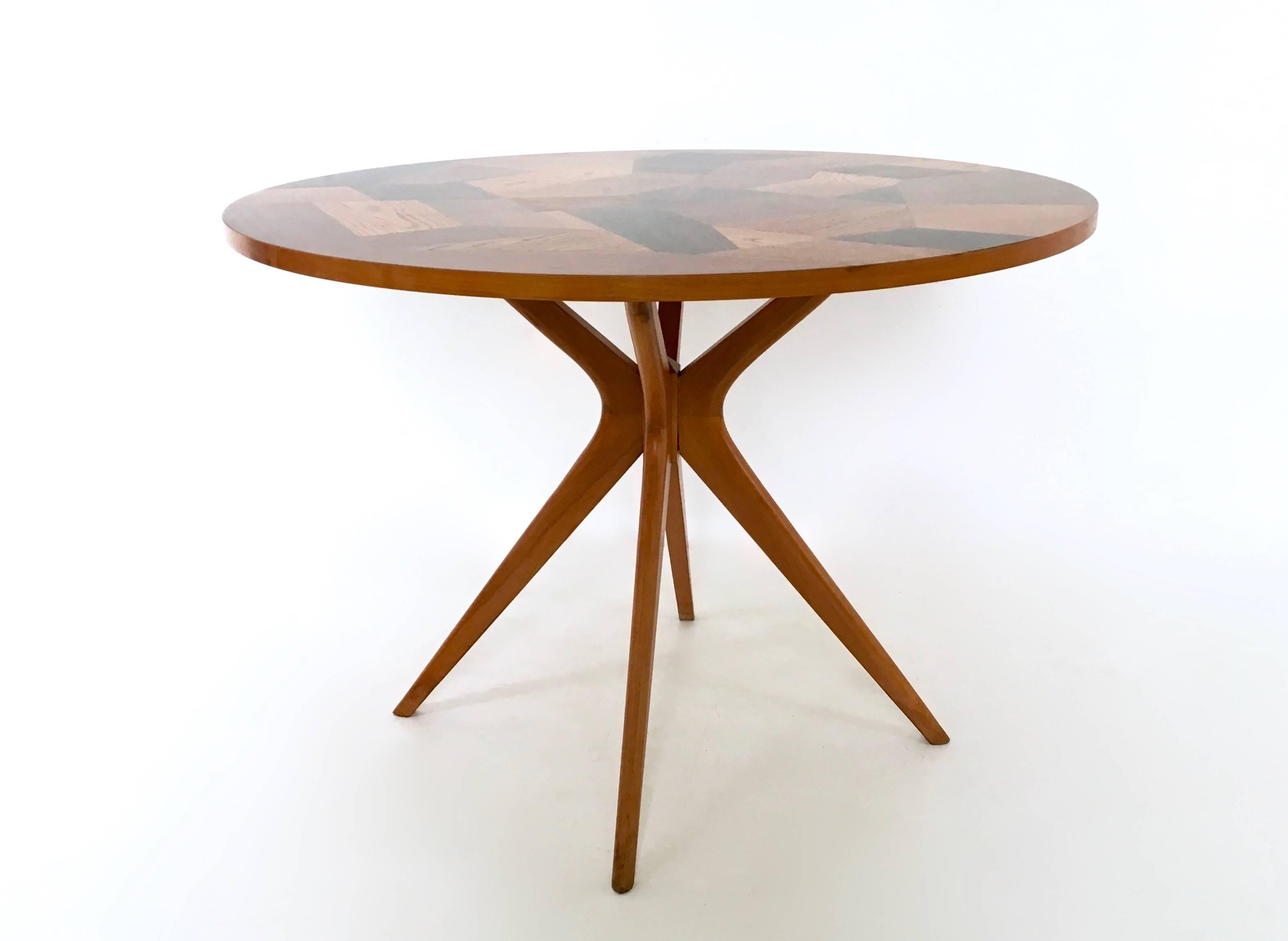 It was designed by Enzio Wenk. 
This table has a manually veneered top made from different woods and a beech leg. 
It was made in 2012 and is in perfect condition. 

This is a unique piece.
  