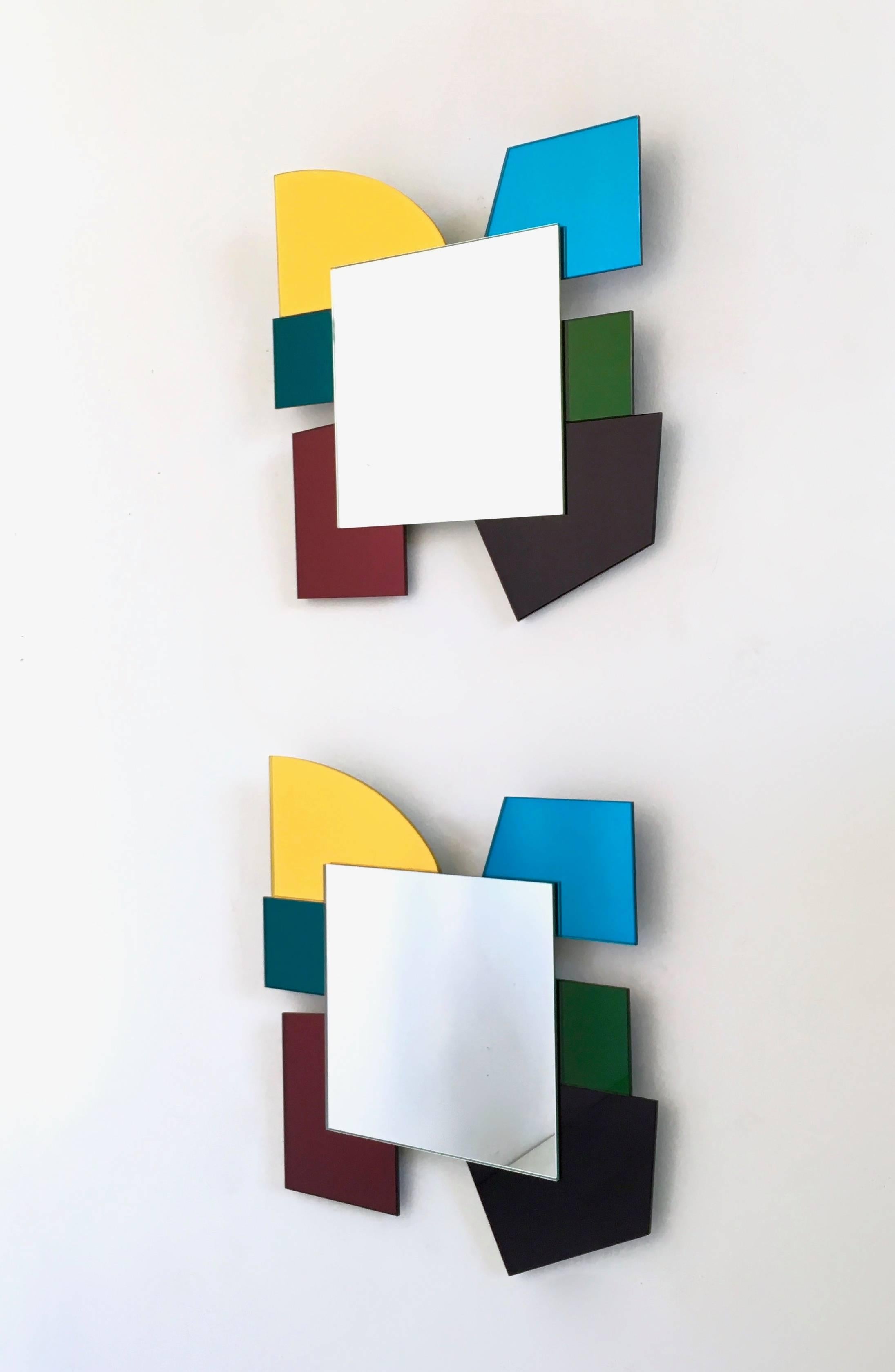 Pair of mirrors in the style of Ettore Sottsass, 2000s. Made with different colored mirrors. 
In perfect condition.