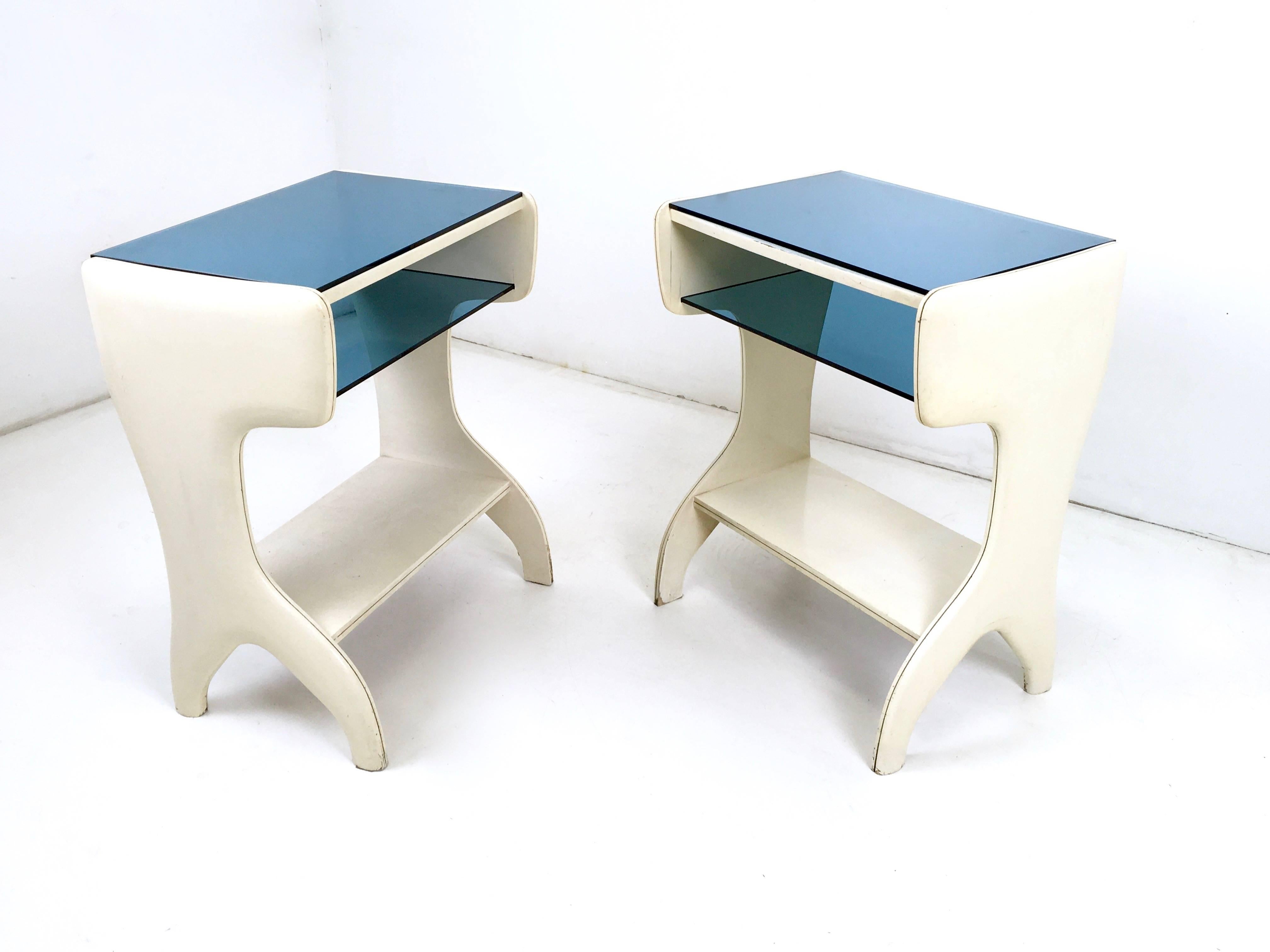Made from lacquered wood and light blue glass. 
In good vintage condition. 