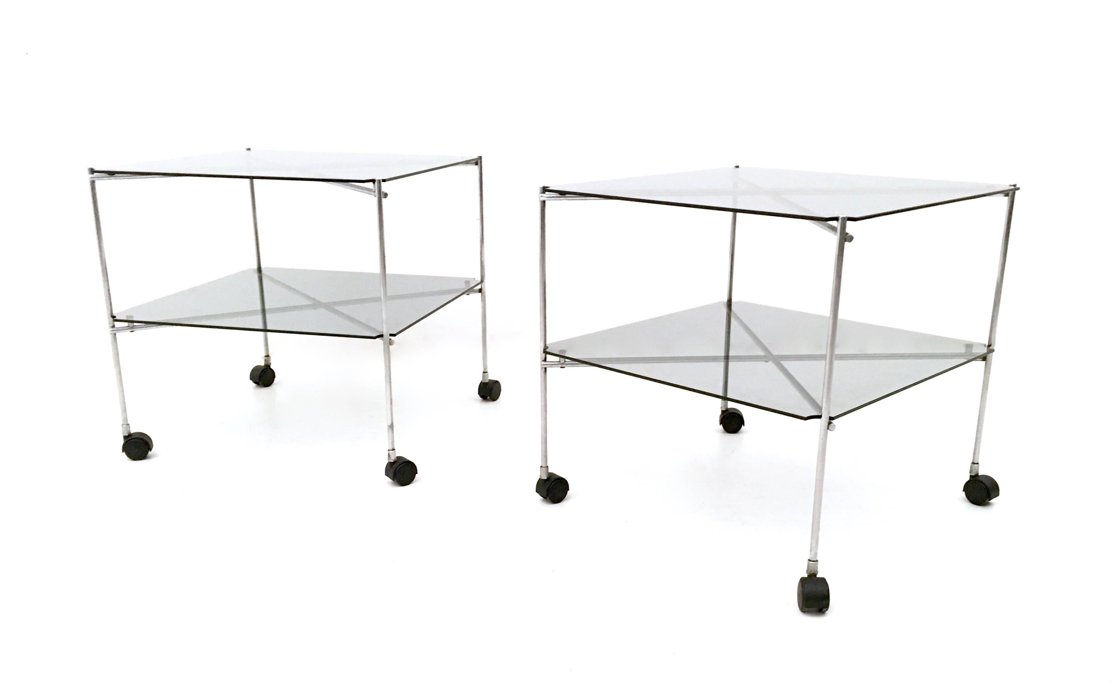 Made in Italy, 1972. 
They feature a thin (but solid) folded metal frame and two glass shelves each.
These carts take their name from the simplicity of their design.
They are vintage pieces, therefore they might show slight traces of use, but they