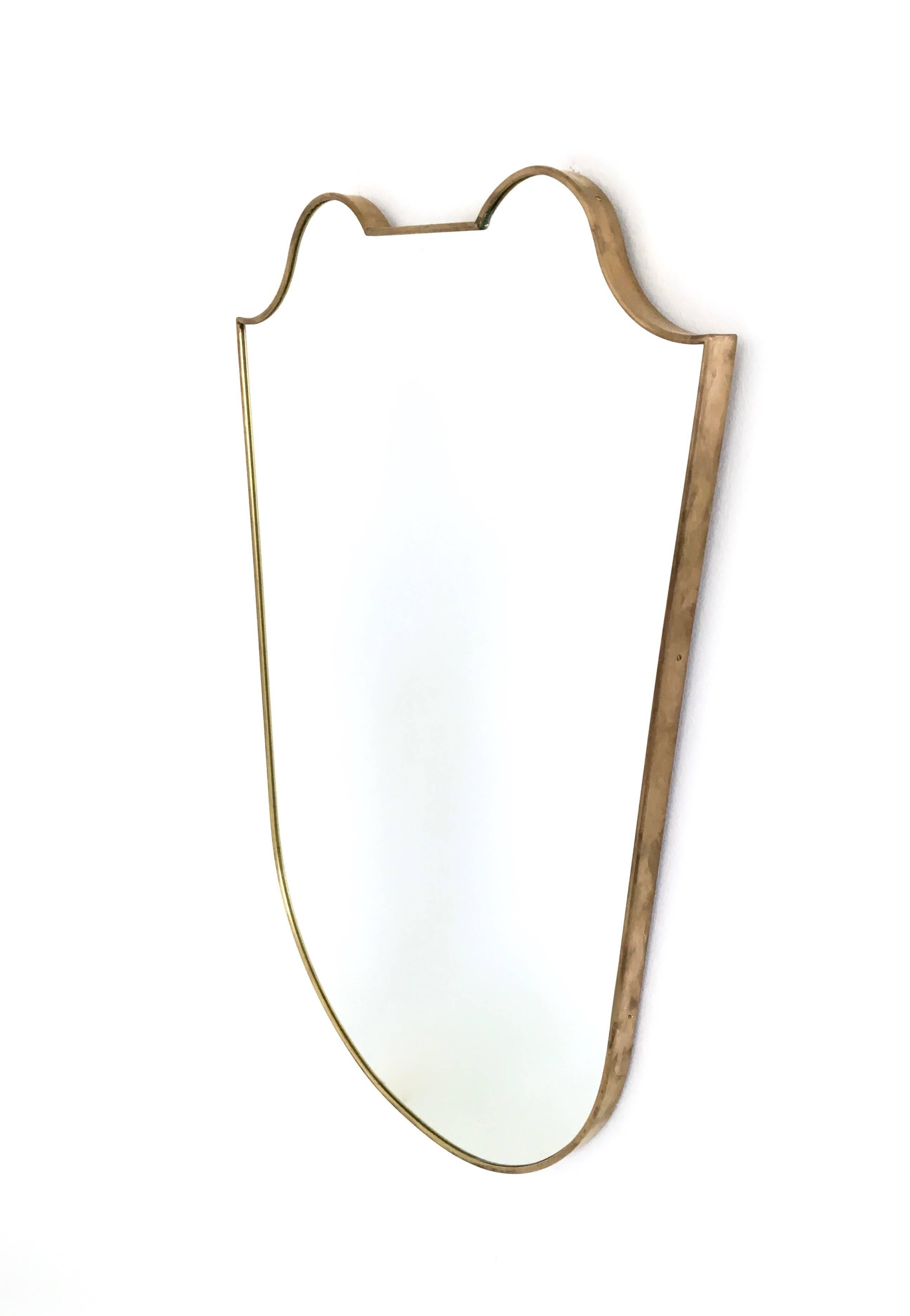 This wall mirror was produced in Italy in the 1950s and is made of brass
In perfect original condition.