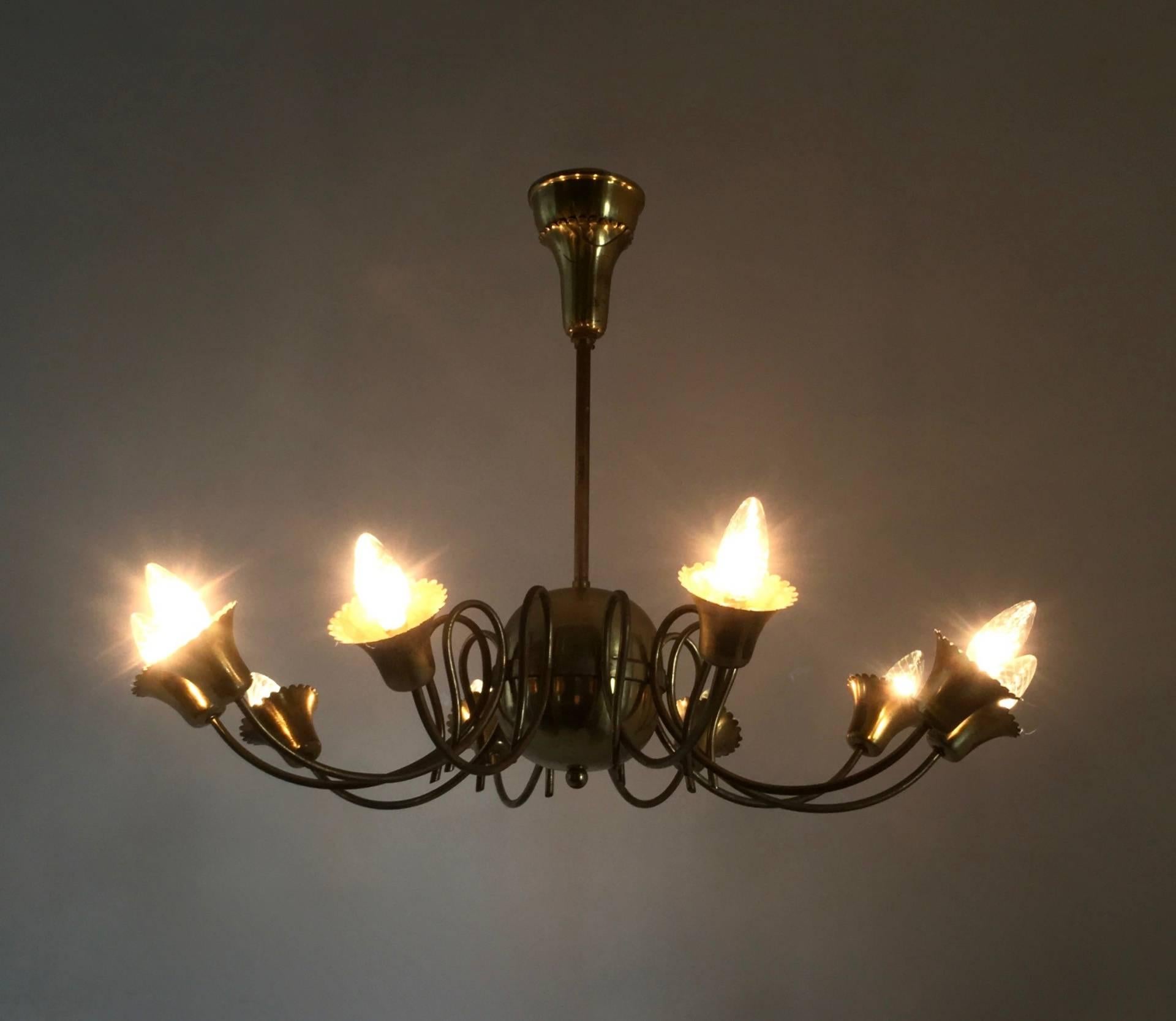 Made in Italy, 1950s. 
This chandelier features a brass structure. 
It is a vintage piece, therefore it might show slight traces of use, but it can be considered as in excellent original condition and ready to gives ambiance to any room. 

Measures: