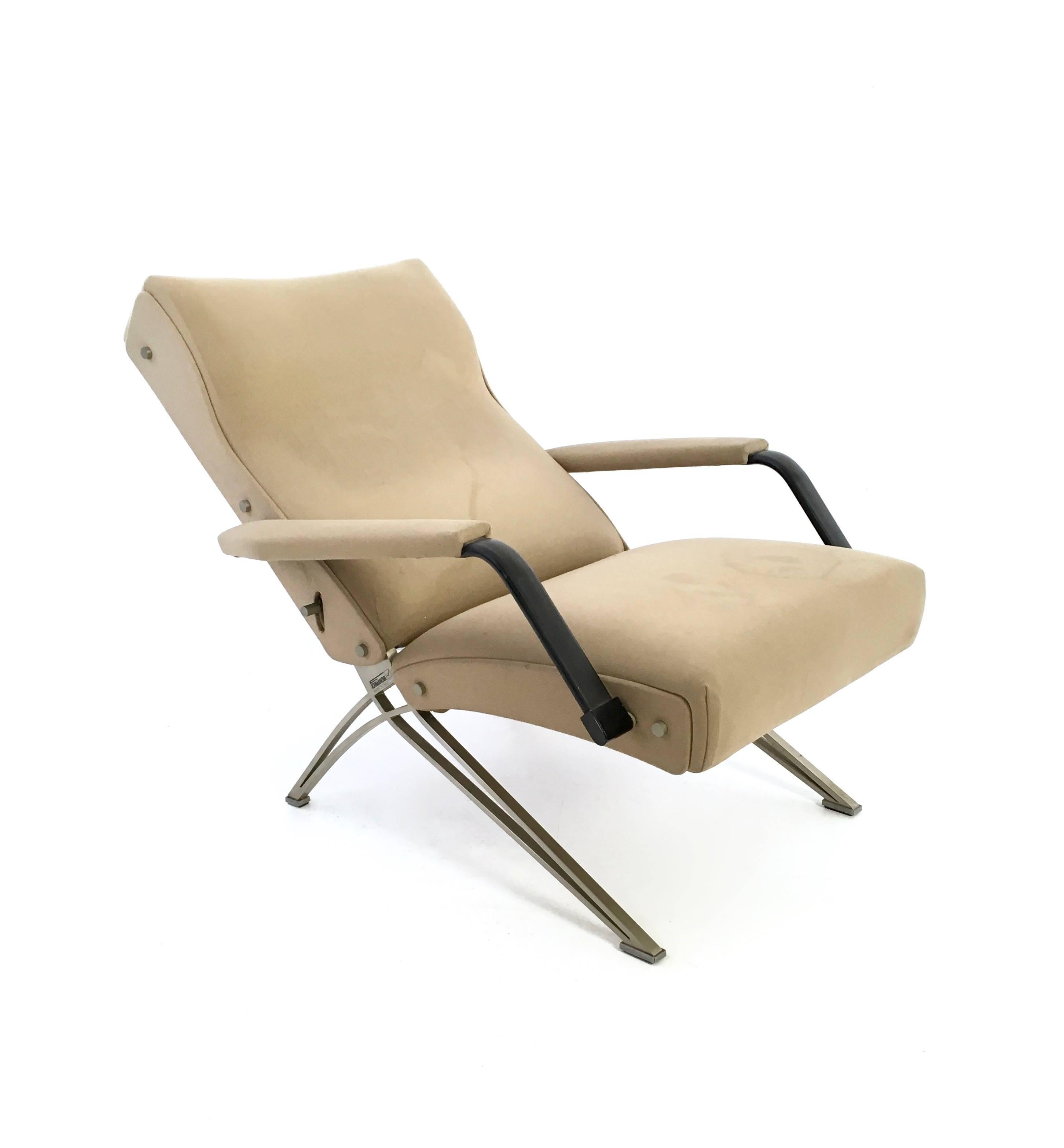 This armchair was designed by Giulio Moscatelli for Formanova and manufactured in Italy. It is made in chromed metal, foam padding and fabric. In fair original condition: its mechanic works perfectly but the fabric has few stains. It features its