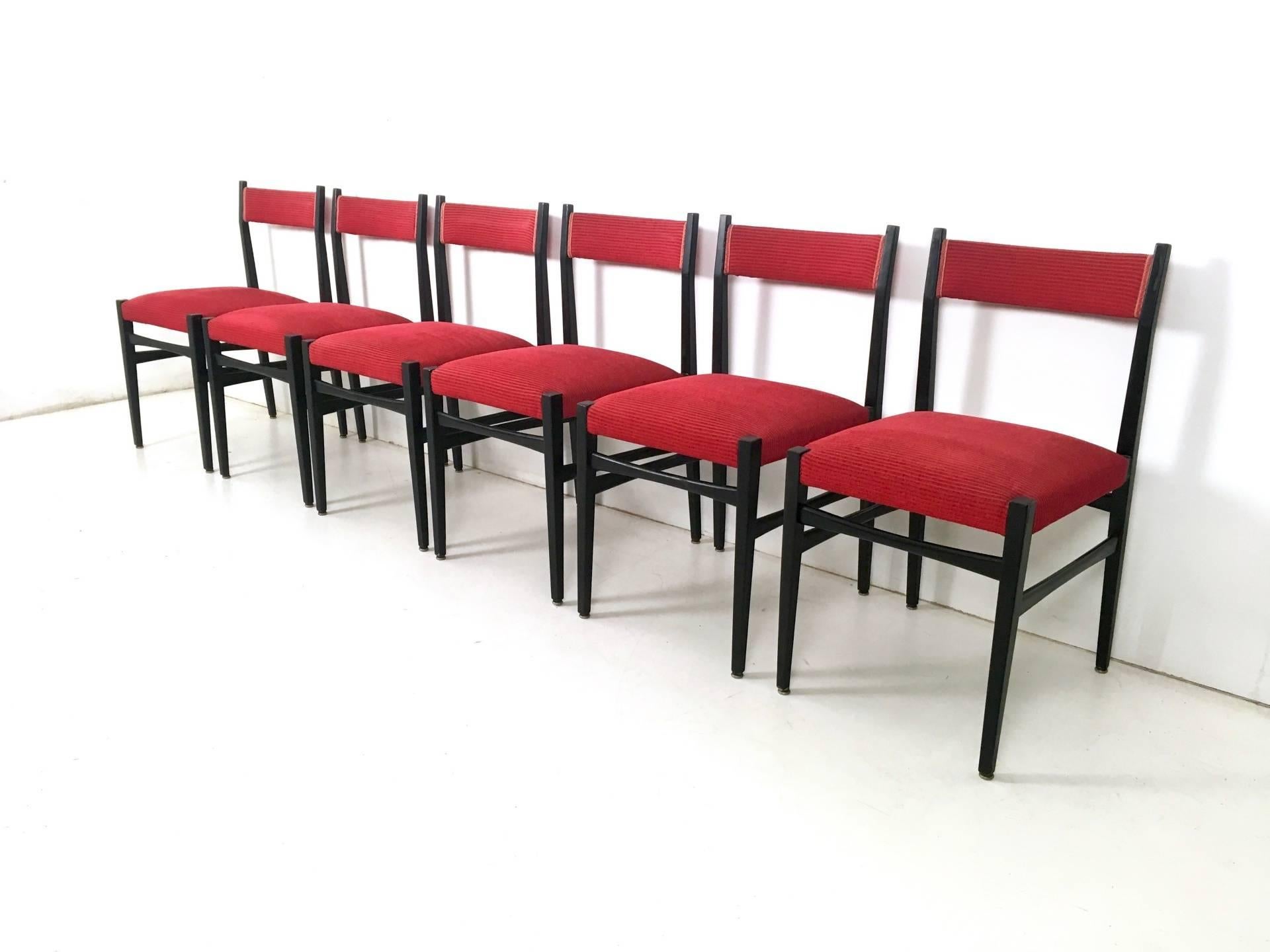 Made in ebonized wood and upholstered in fabric. 
In good original condition.

  