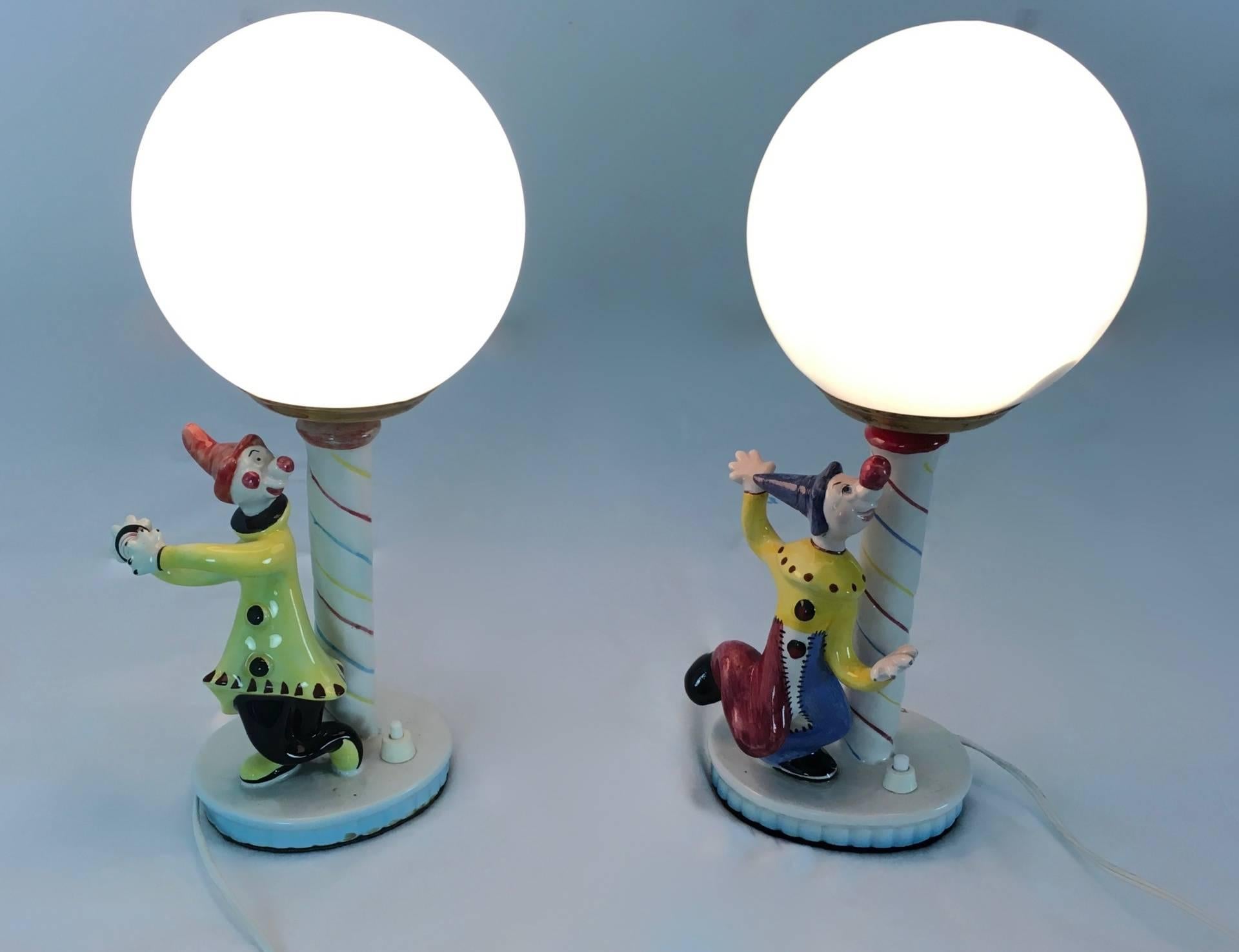 Pair of table lamps, Italy, 1950s. Made in ceramic and opaline glass.
In perfect original condition and ready to give a beautiful ambiance to any room.

Diameter: 15 cm
Height: 33 cm