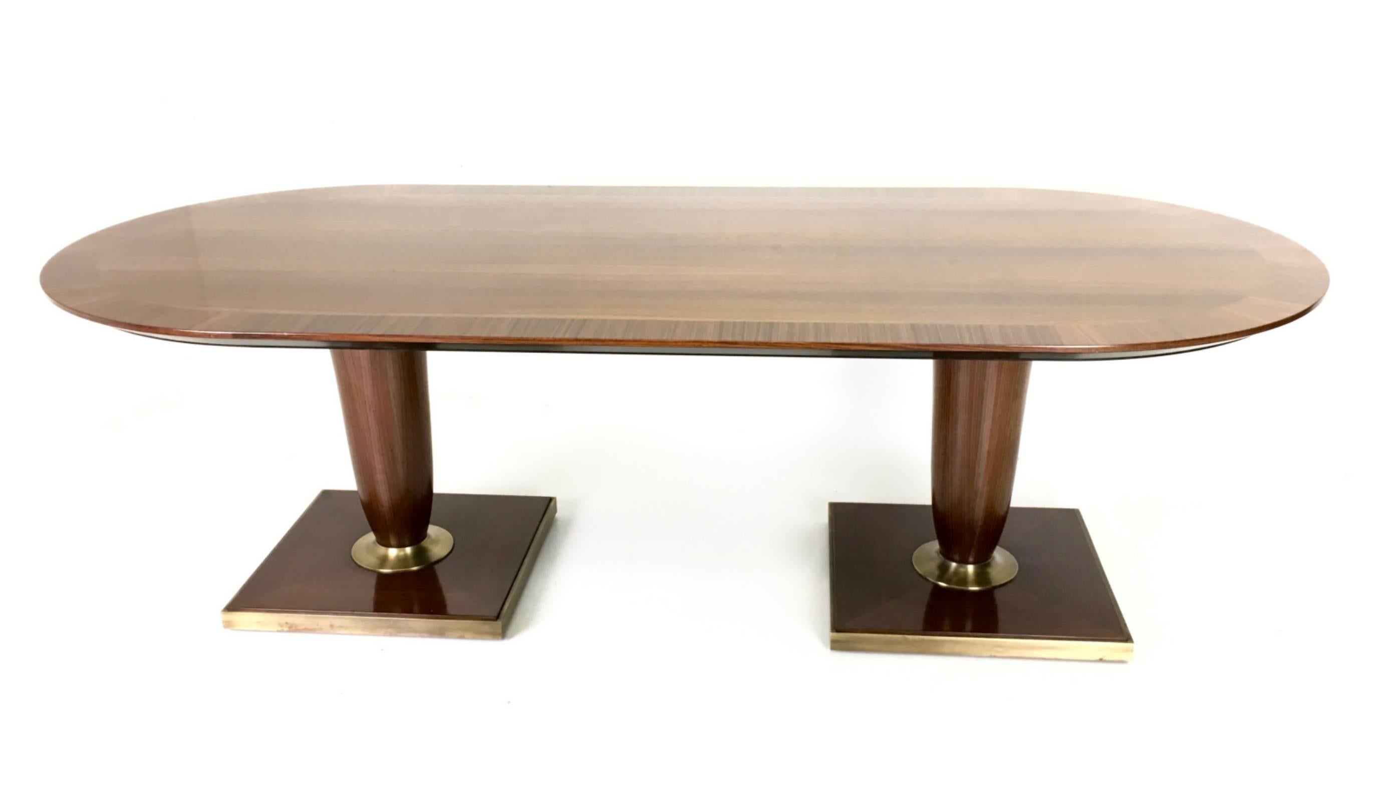 It is a beautiful high-quality conference table, made in black walnut and brass.
In perfect original condition and ready to become apiece in a home.

Width: 240 cm
Depth: 108 cm
Height: 73 cm