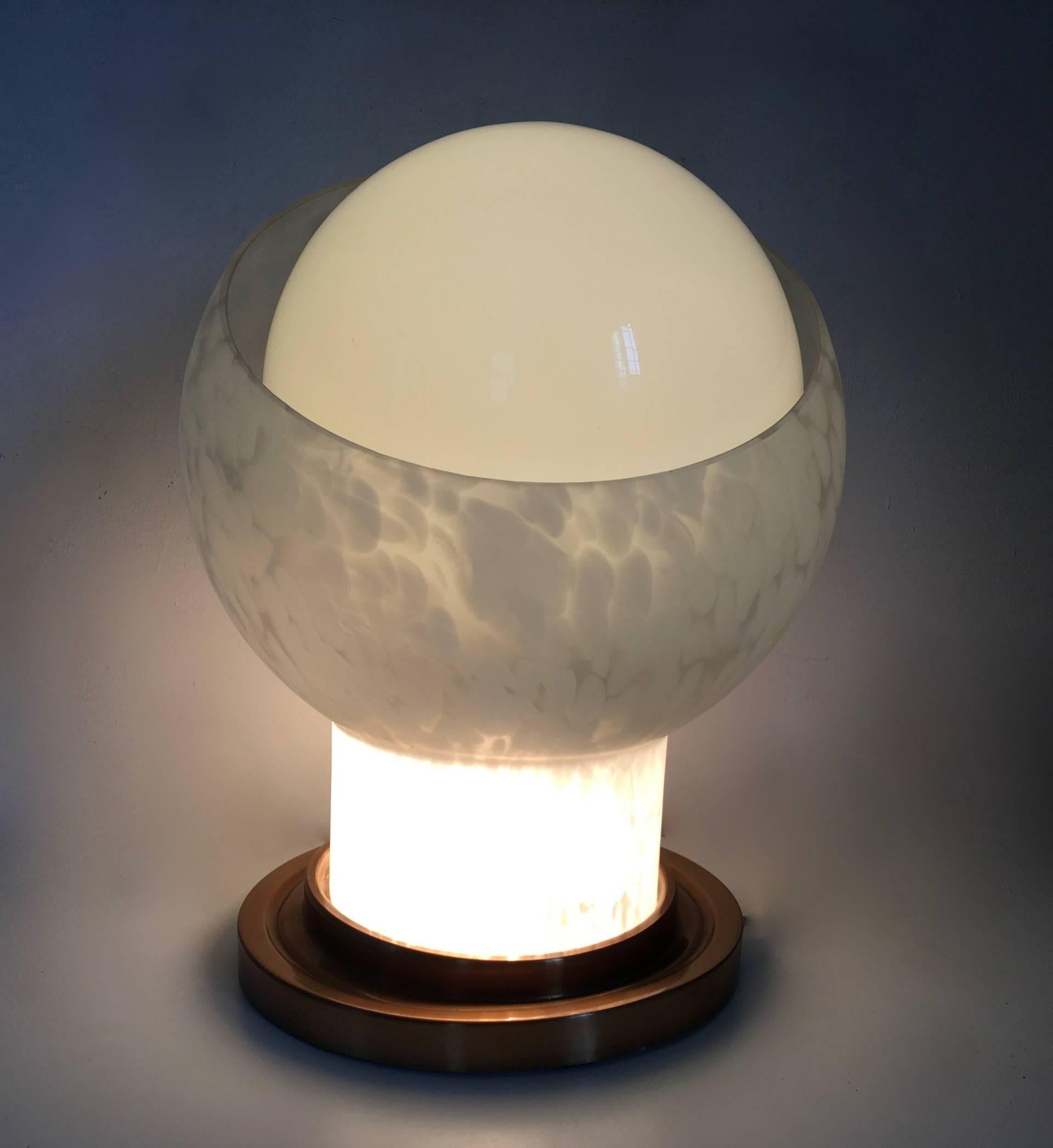 Made in Italy, 1970s. 
It features a spheric blown glass lampshade and a brass base.
It is a vintage piece, therefore it might show slight traces of use, but it can be considered as in perfect original condition

Measures: 
Diameter 38 cm 
Height 49