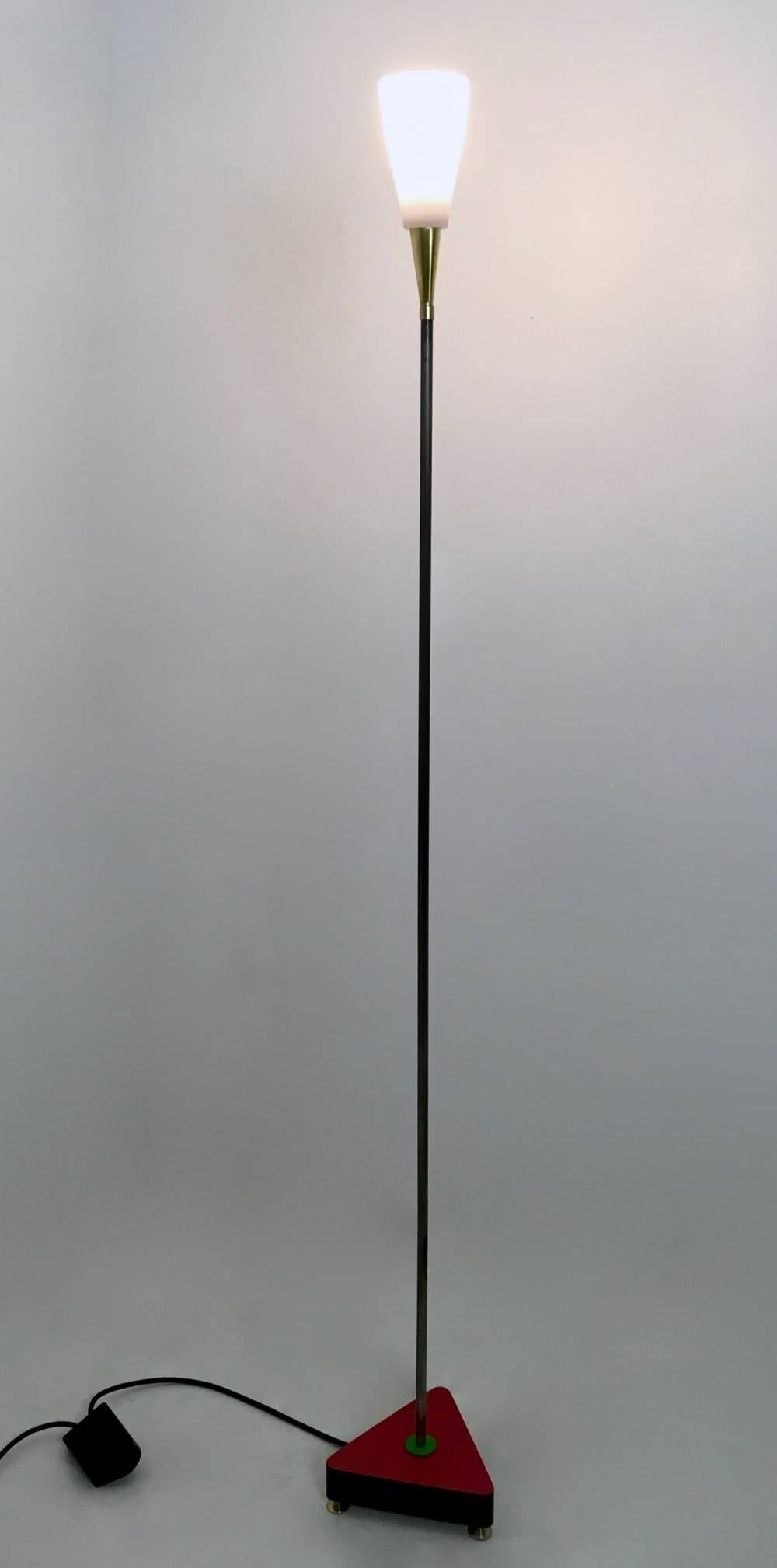 This floor lamp is made in lacquered wood, iron polished with shellac, formica, lacquered metal and brass. It features an etched glass lampshade. 
It is one-of-a-kind.
In mint condition and ready to give a beautiful ambiance to any