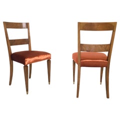 Juego de diez sillas de comedor de tapicería de tela naranja y madera de nogal, Italia