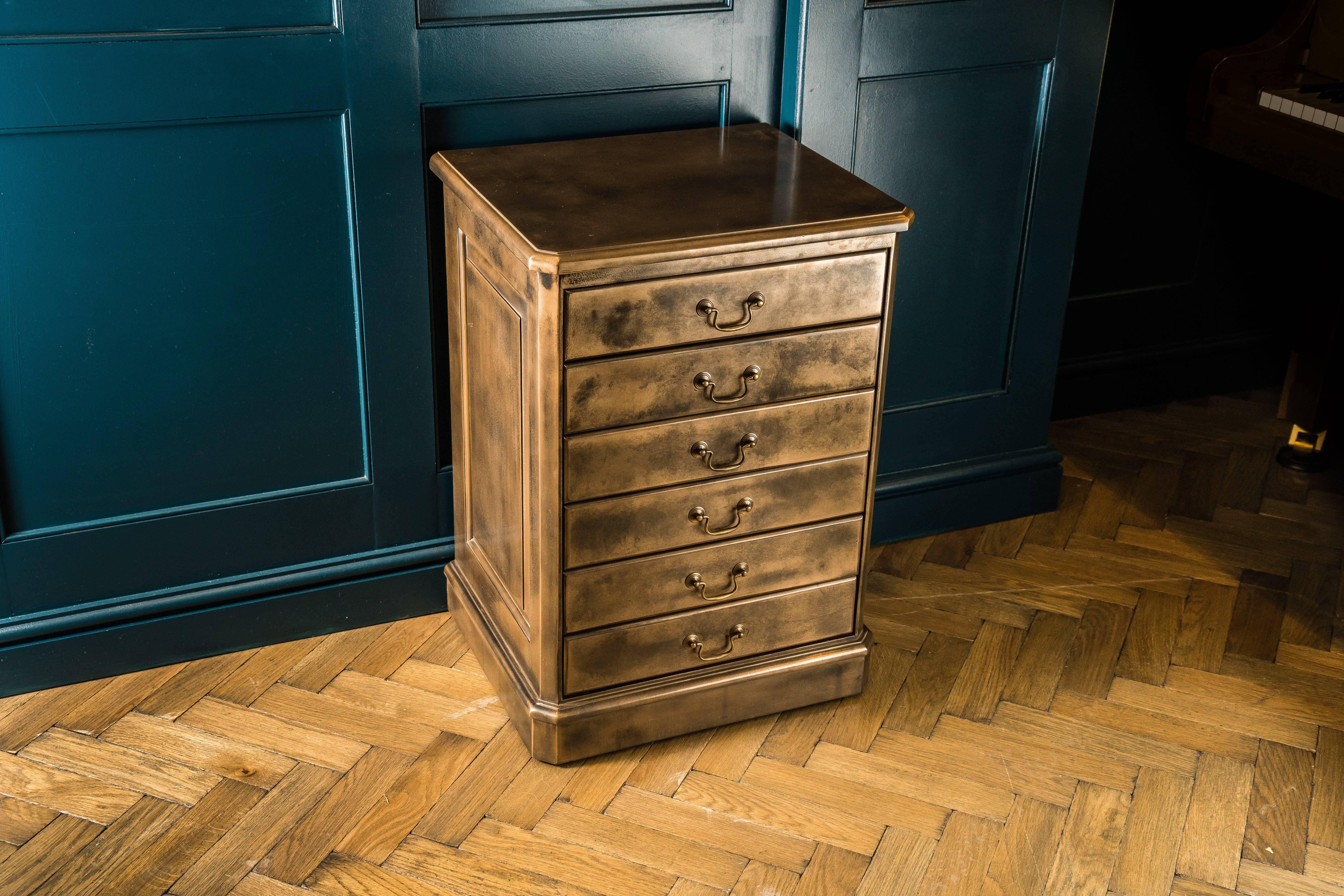 A unique opportunity to acquire an elegant six-drawer music cabinet with a truly modern finish. 

This cabinet was handcrafted in the UK. It is made out of solid mahogany and has six drawers. Each drawer features elegant brass handles and fold