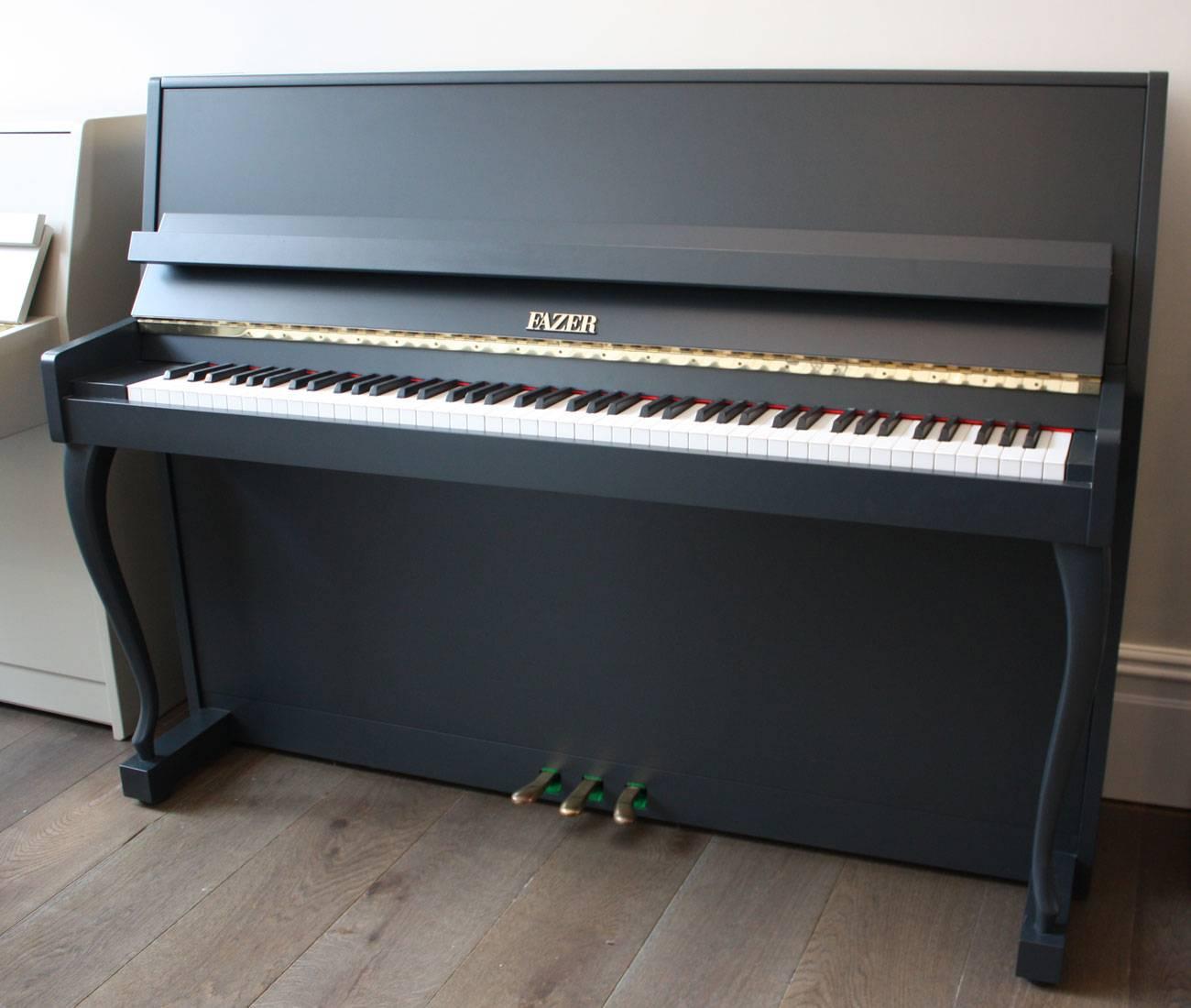 A stylish piano made by the Finnish company Fazer. Fazer produced good quality upright pianos that have stabile tuning and good responsive actions. This model has a good medium touch and clear resonant tone with warmth. It has been expertly finished