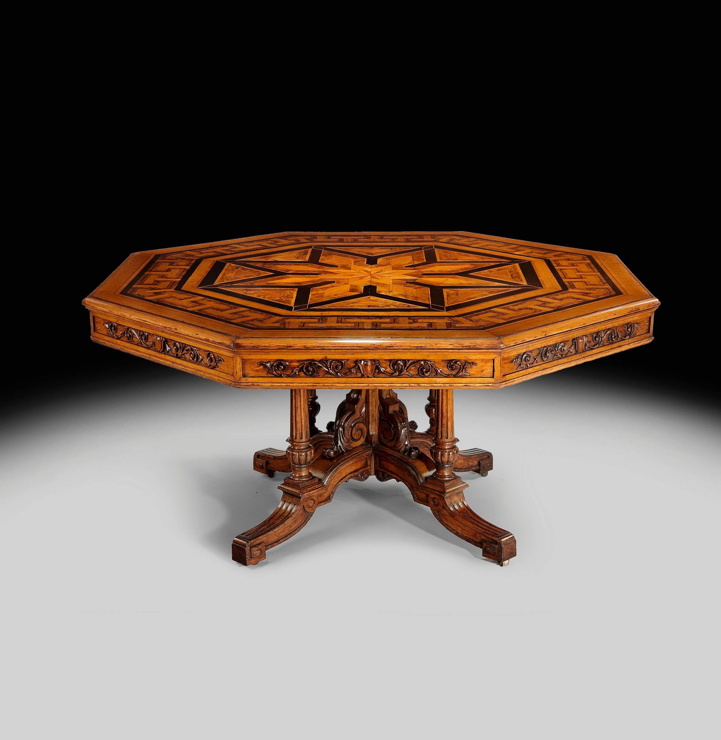 This unique table dating from the mid-19th century is absolutely superb. It is made from oak and has a top that is parquetry inlaid with oak, walnut, stained pear wood and box wood. The frieze has two long pull out drawers and the whole apron is
