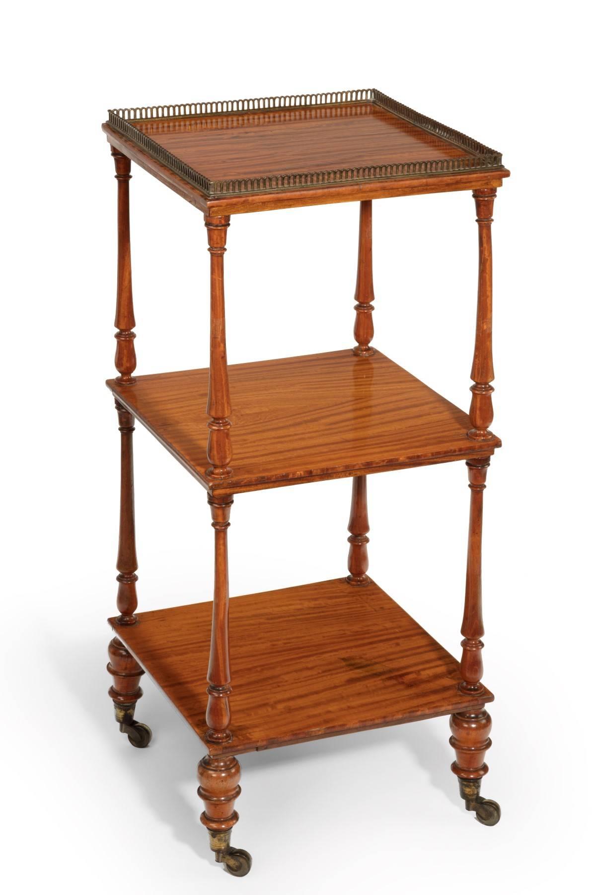 Veneered in figured satinwood with the secondary timbers being mahogany, the etegere is of first class quality and has an original pierced brass gallery to the top. It is a very good color. From the quality and style it is attributed to Gillow. It