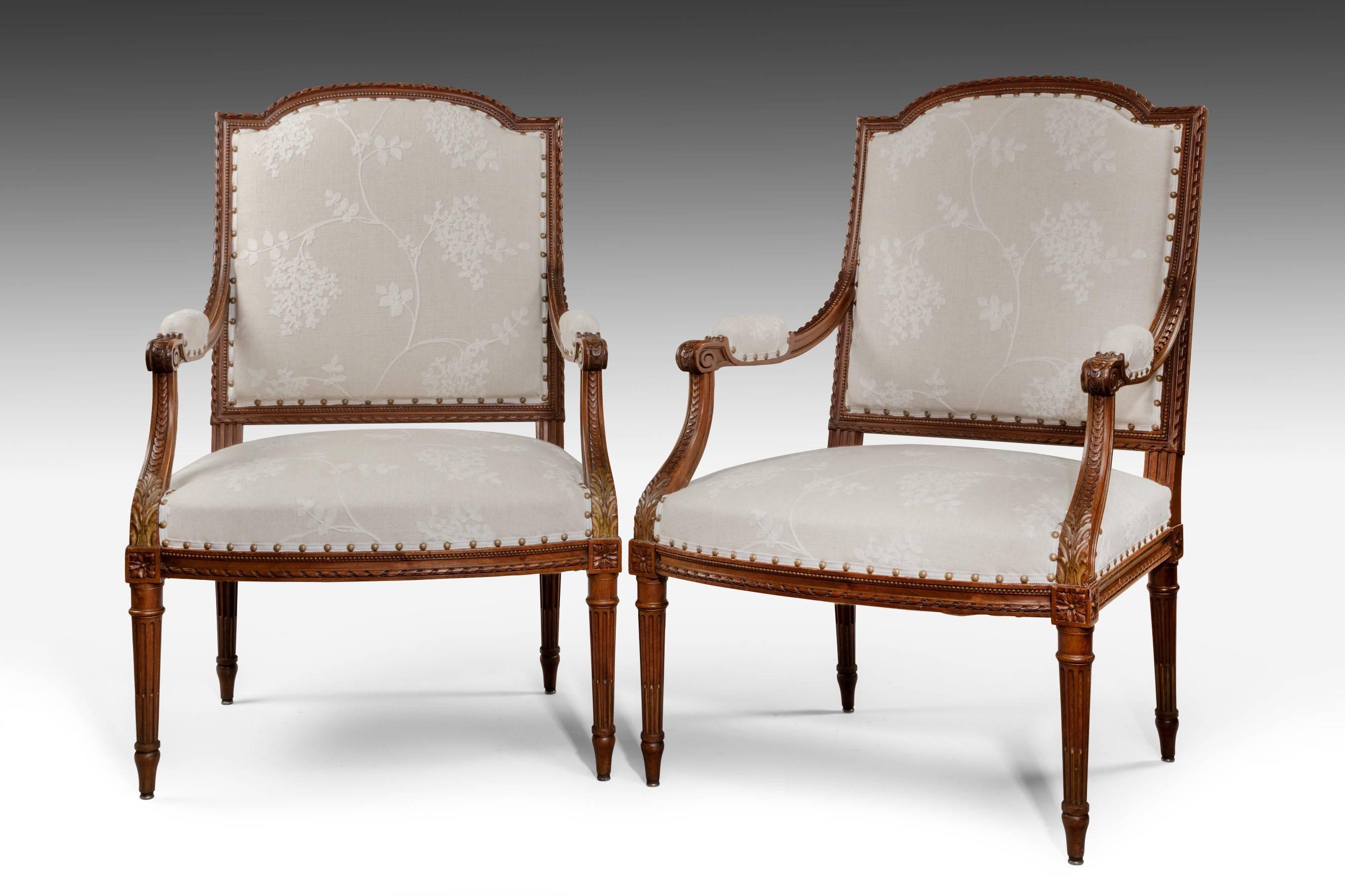 Made from Cuban mahogany, these chairs are generous in proportion and decorated with good quality carving. They have been upholstered with sprung seats and so are very comfortable to sit in. The chairs are a good untouched colour with a dry waxed