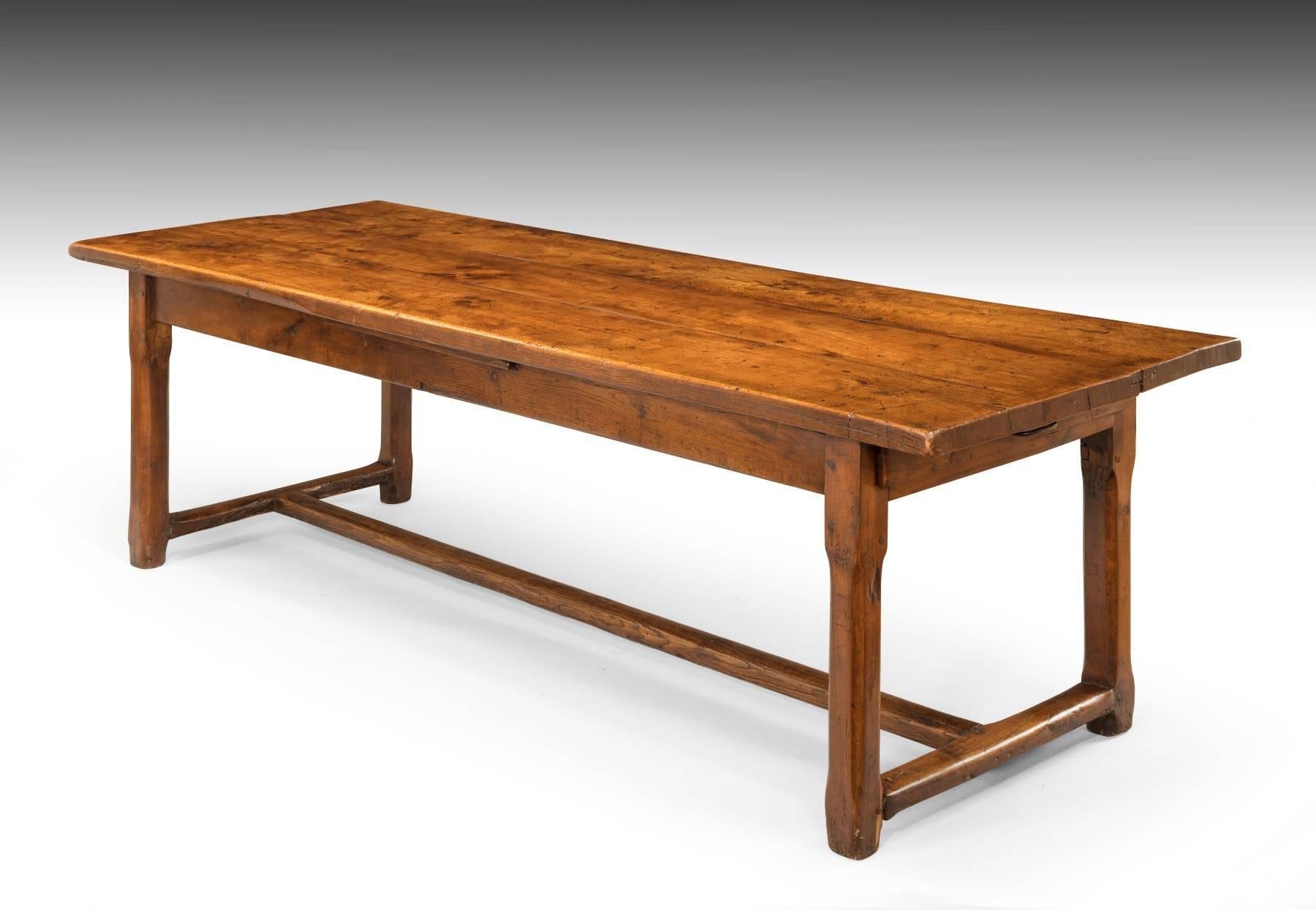 Of really great scale and with a thick planked top, this table has both drawers at each end and an unusual pull-out side serving slide. It is a really good color with super patination. A great table with great character! It is currently at our