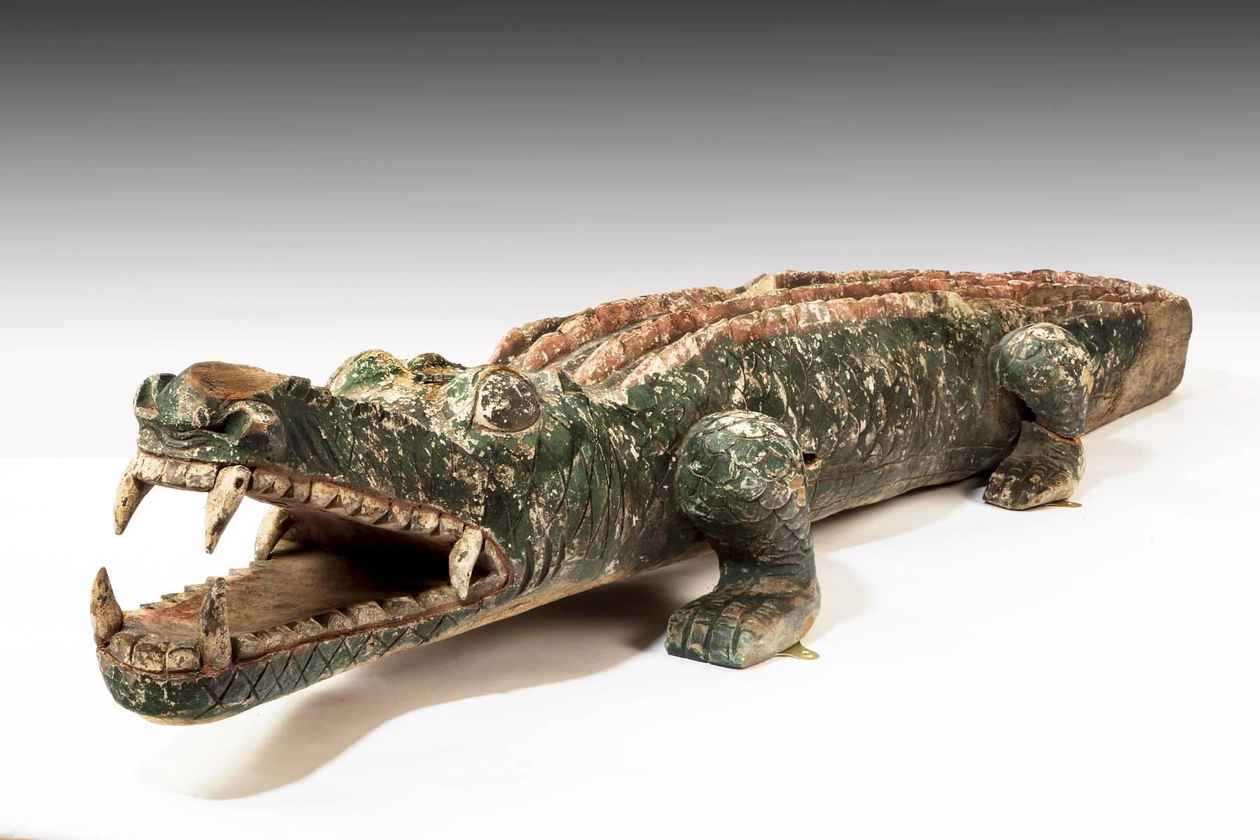 This late 19th century lifesize carved wood crocodile retains its original decoration. It has a really great look and in the right spot would make a room. It is currently at our Charleston location.