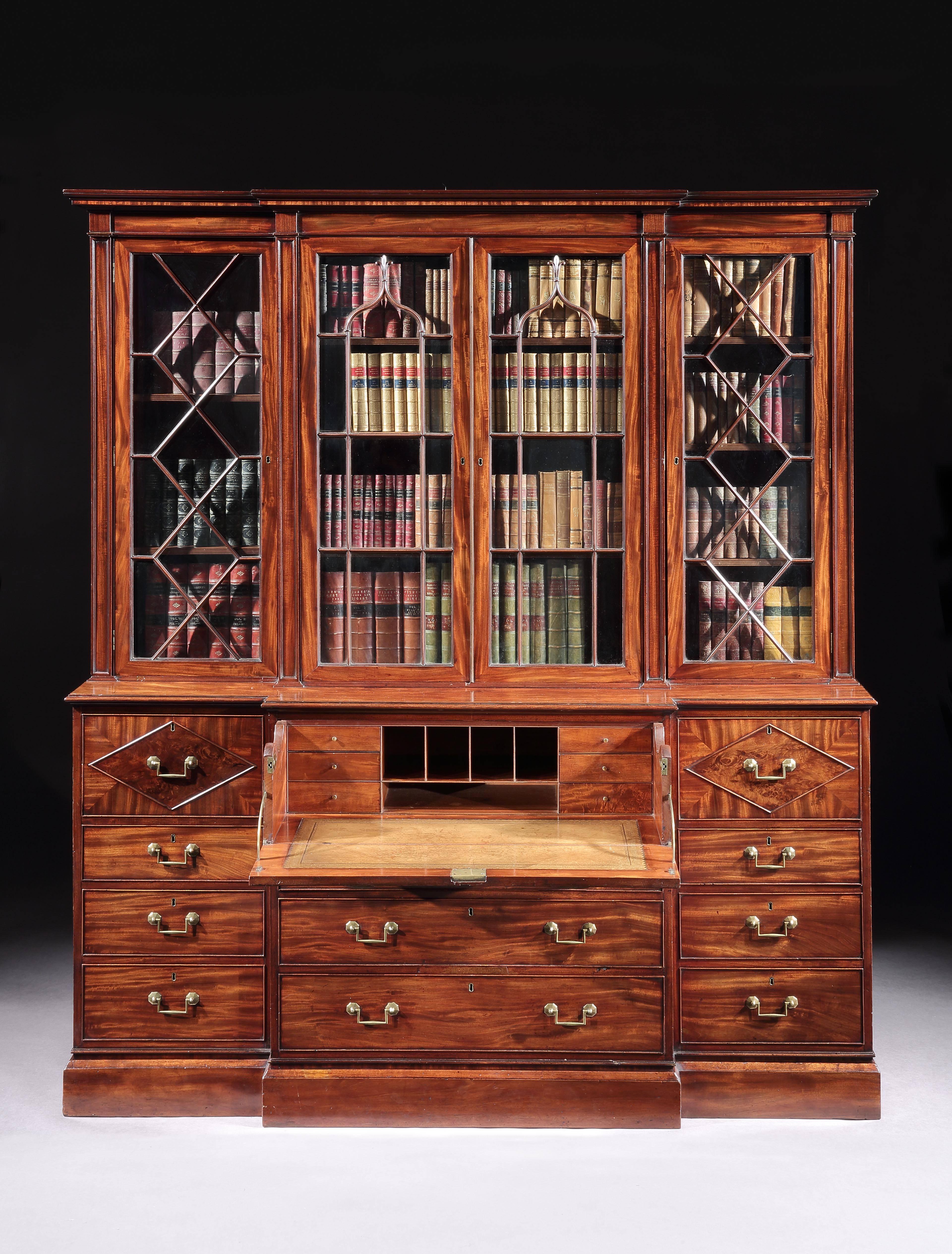 Of unusually small size and under six feet wide, this George III breakfront bookcase with a fitted secretaire interior, is original throughout. It has a label showing that it was the property of Lord Teignmouth who was the first Governor General of