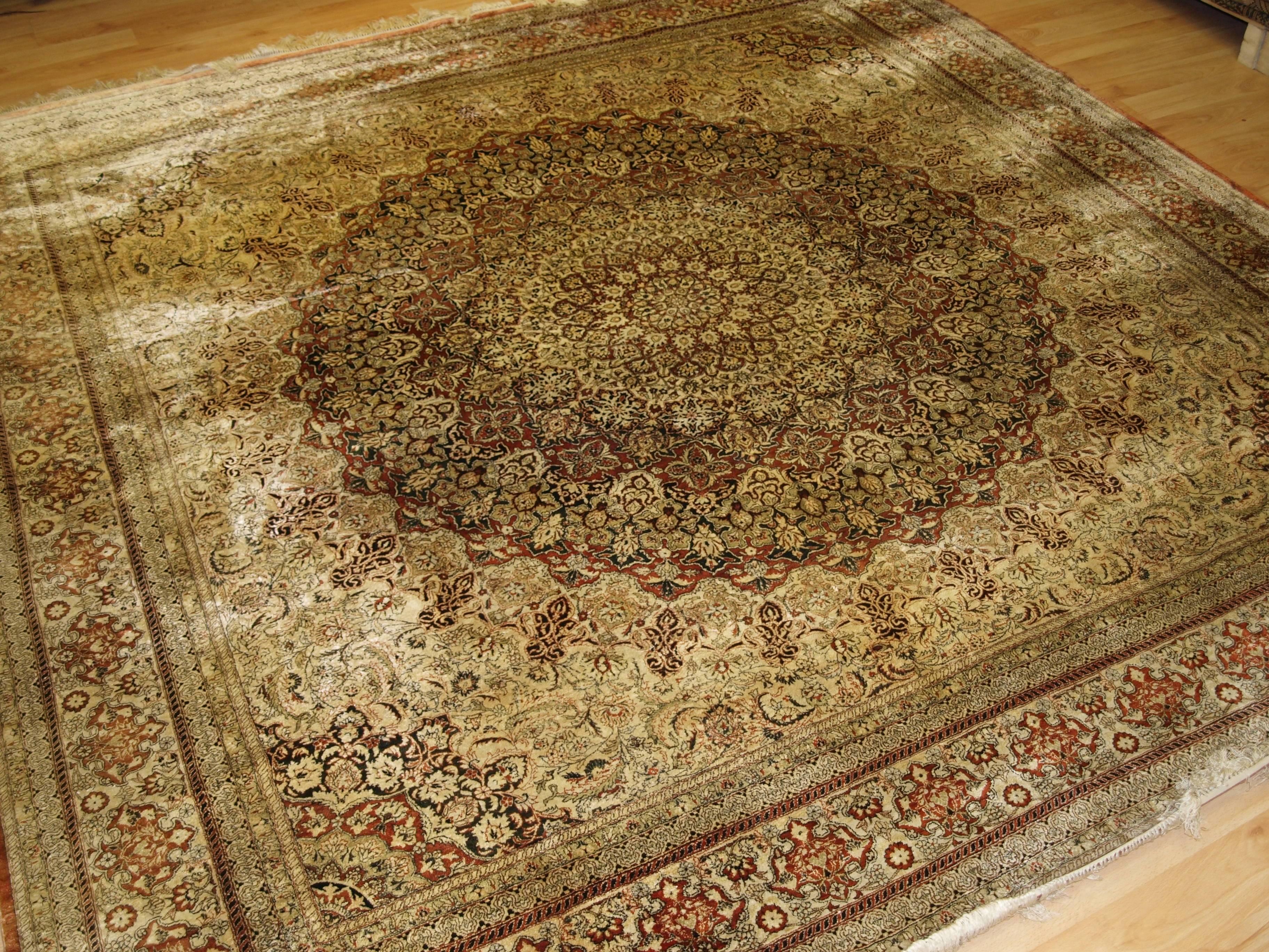 Size: 8 ft 2 in x 8 ft 1 in (250 x 248 cm).

A really beautiful example of a Chinese silk rug in the Turkish Hereke style with a very classical medallion design. 

About 20 years old.

The rug is of fine weave and superbly drawn; clearly a rug