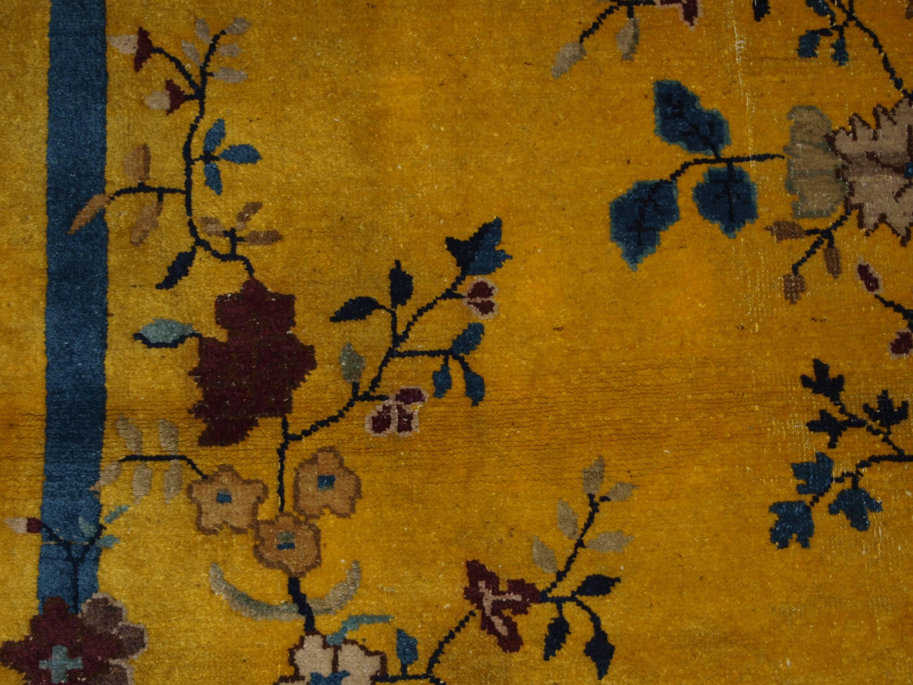 Size: 5ft 9in x 4ft 1in (175 x 125cm).

Antique Chinese yellow ground peking rug, 

circa 1900.

A striking rug with the Classic Chinese garden design with trees in full blossom. 

The rug is in good condition with even wear and good pile.