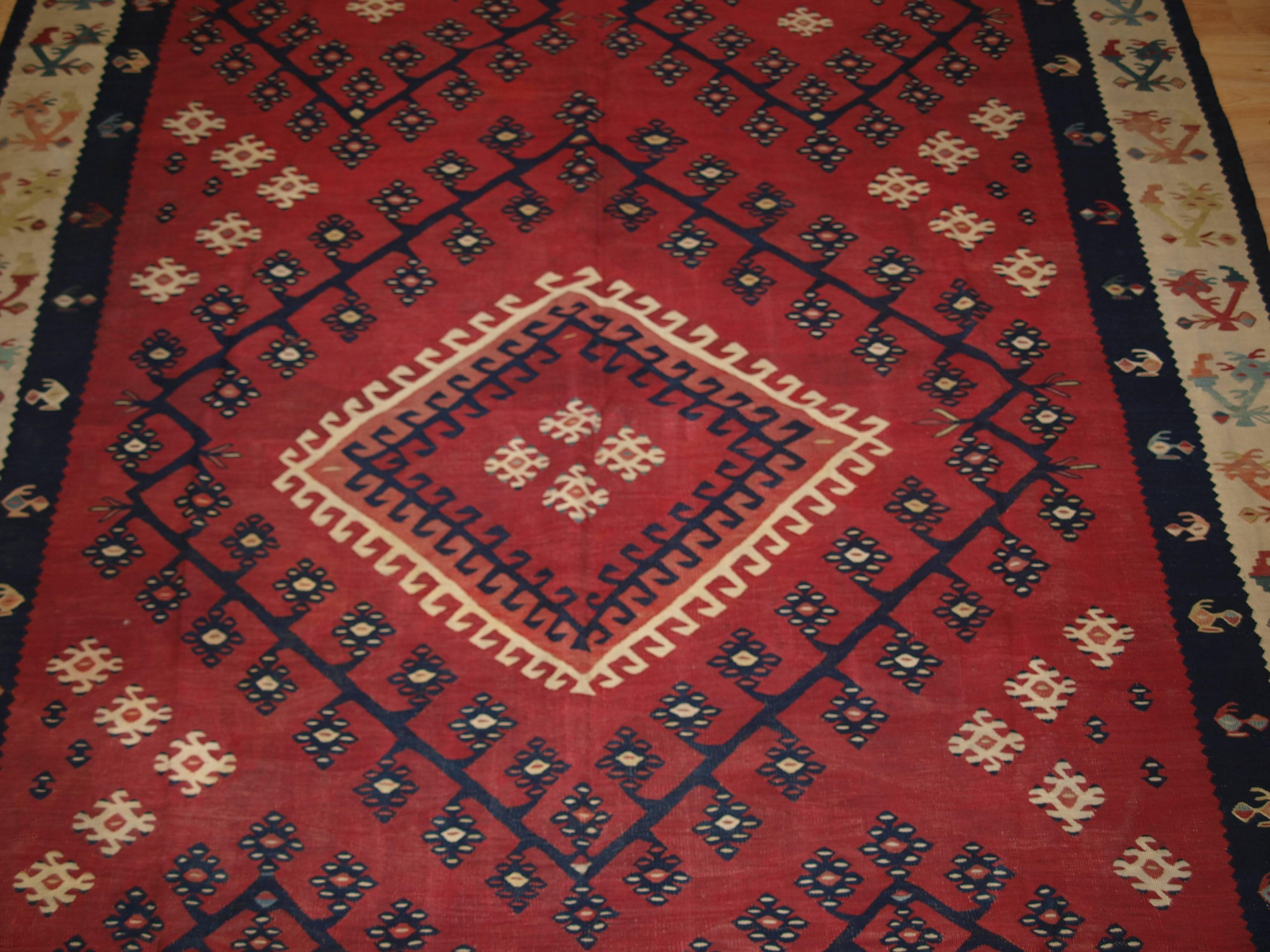Size: 7ft 10in x 5ft 10in (240 x 178cm).

Antique anatolian Sharkoy Kilim, Western Turkey, 

circa 1870.

A really outstanding example of an early Sharkoy Kilim with cochineal dye which is only found in the earliest examples.

Sharkoy kilims