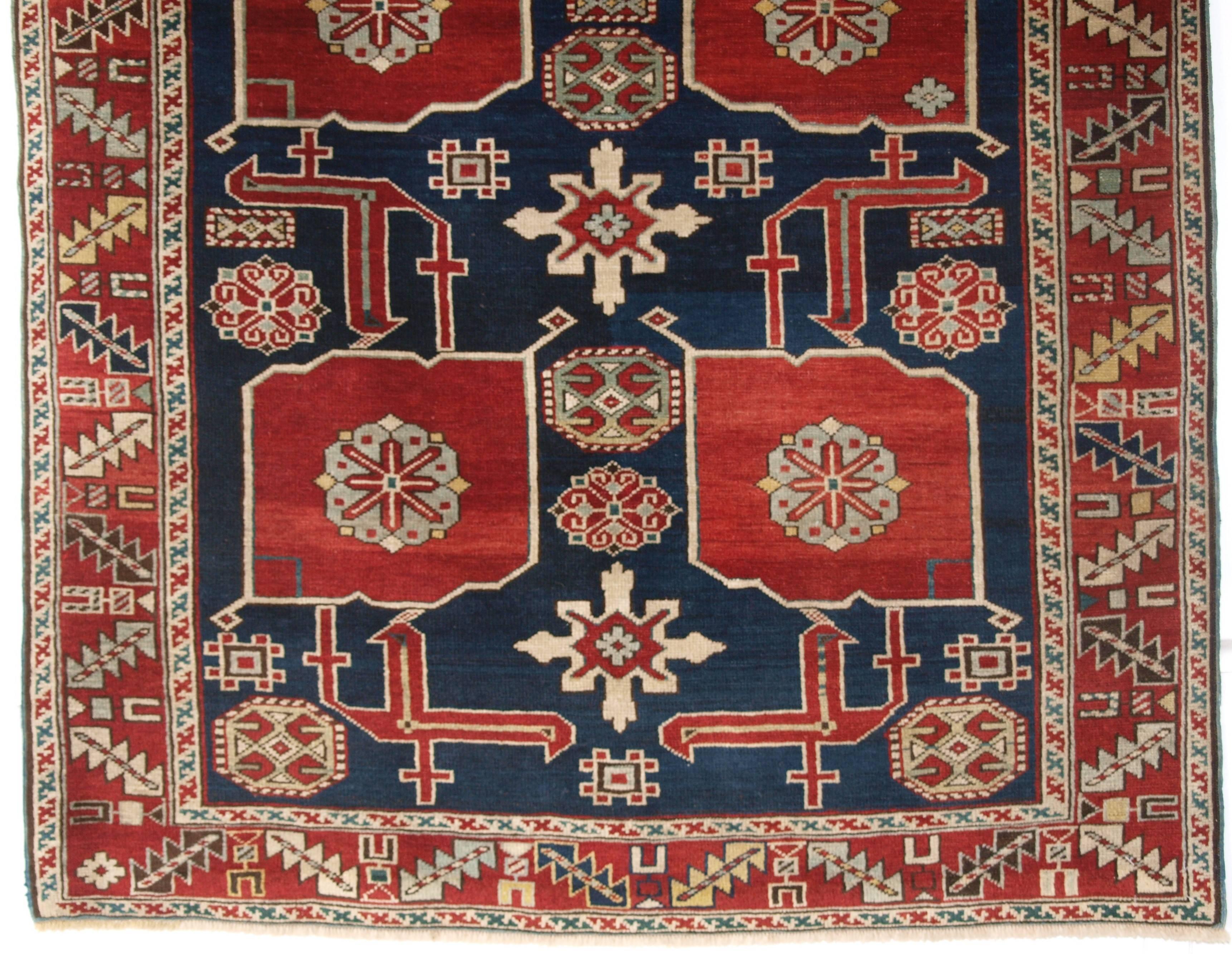 Size: 4ft 9in x 3ft 0in (145 x 91cm).

Antique Caucasian Kuba rug from the village of Karagashlim, 

circa 1890.

The rug is a very well-drawn example of this classic Caucasian design. The deep indigo field with palmettes, dragons, snow flakes