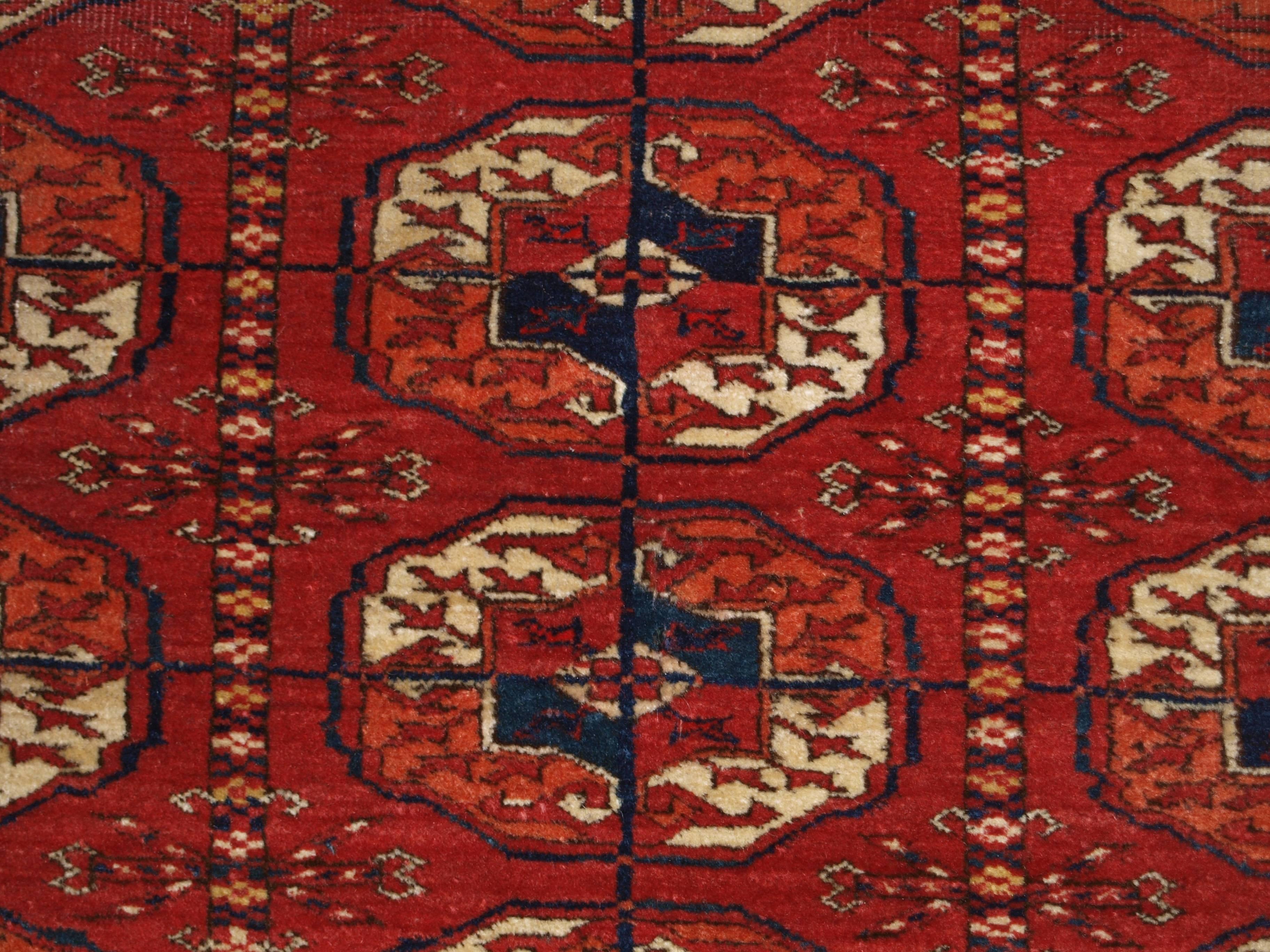 Size: 5ft 0in x 3ft 9in (152 x 115cm).

Antique Tekke Turkmen rug of excellent design and color, fine weave and small size; the rug is of a soft red color, 

circa 1900.

The rug has a traditional Tekke gul design with 3 rows of 9 guls.