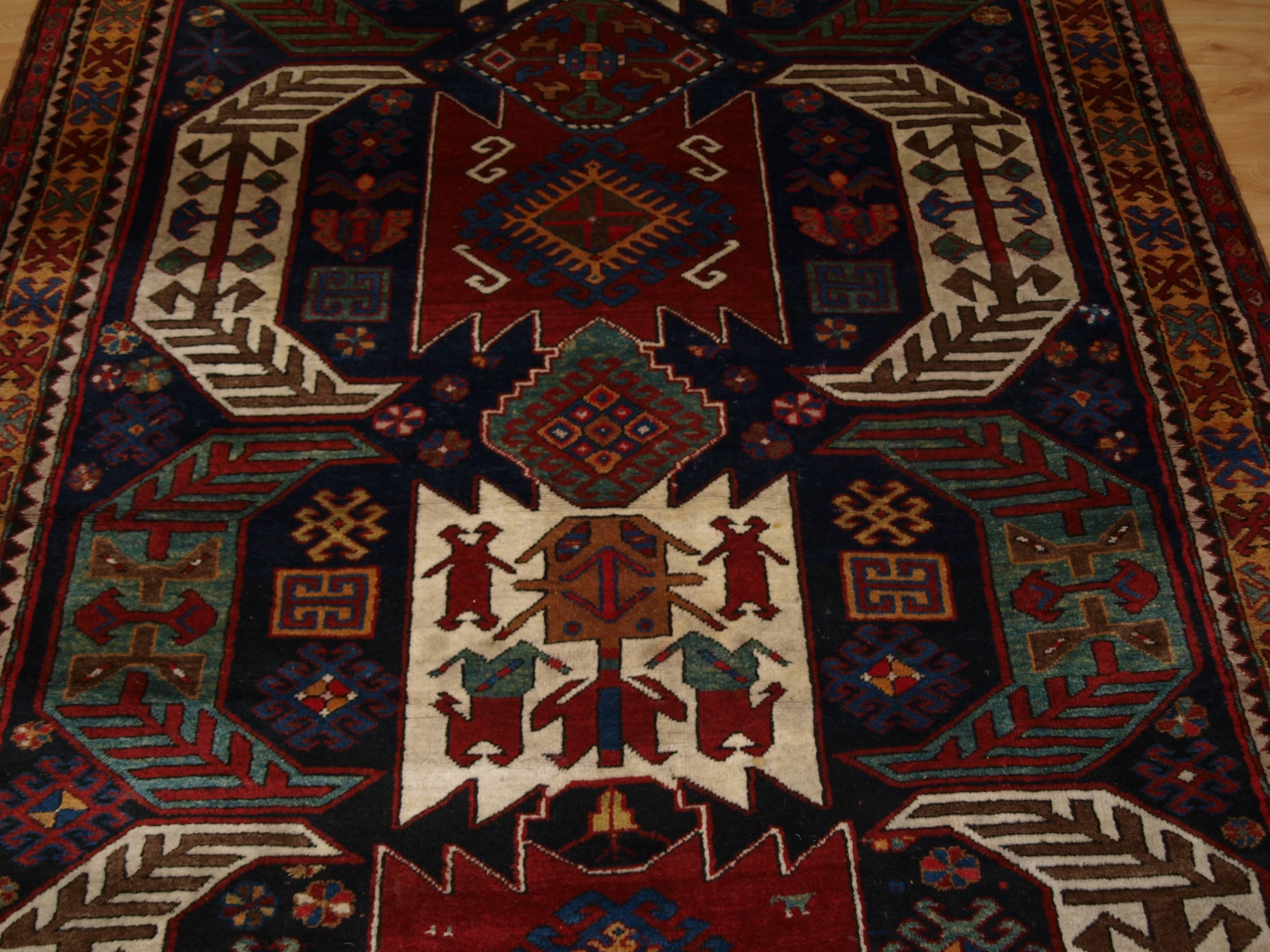 Size: 8ft 10in x 5ft 9in (268 x 174cm).

Antique Caucasian Kasim Ushak or Lenkoran region rug of outstanding bold design with stunning colours.

Circa 1900.

This rug is a good large size example of type, the drawing and colour palette is of