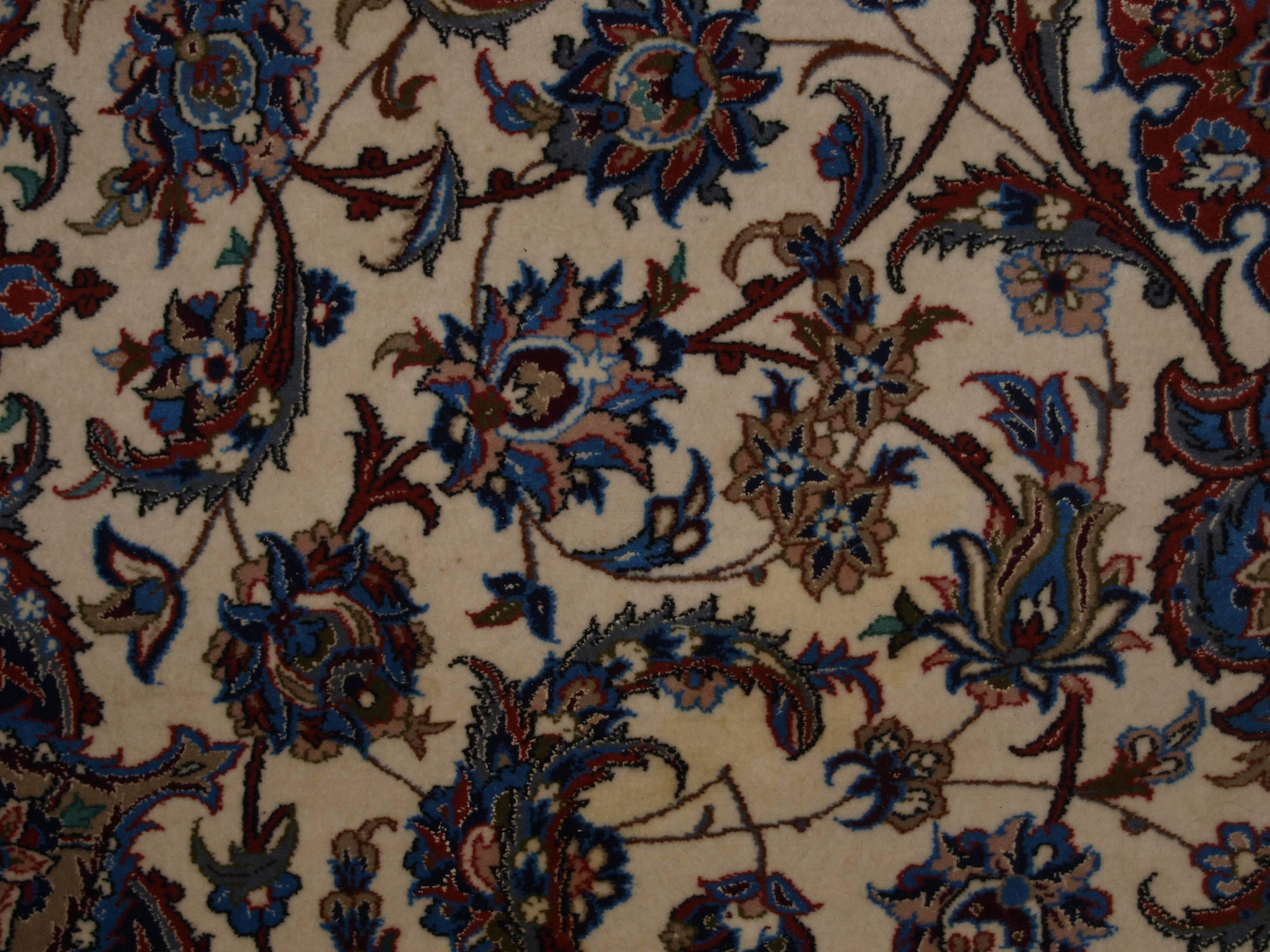 Size:10ft 6in x 6ft 7in (320 x 200cm).

Old Persian Isfahan carpet, wool and silk on a very fine silk foundation. 

About 40 years old.

The carpet is of very fine weave with tight fine pile of lambs wool with silk high lights. The carpet has