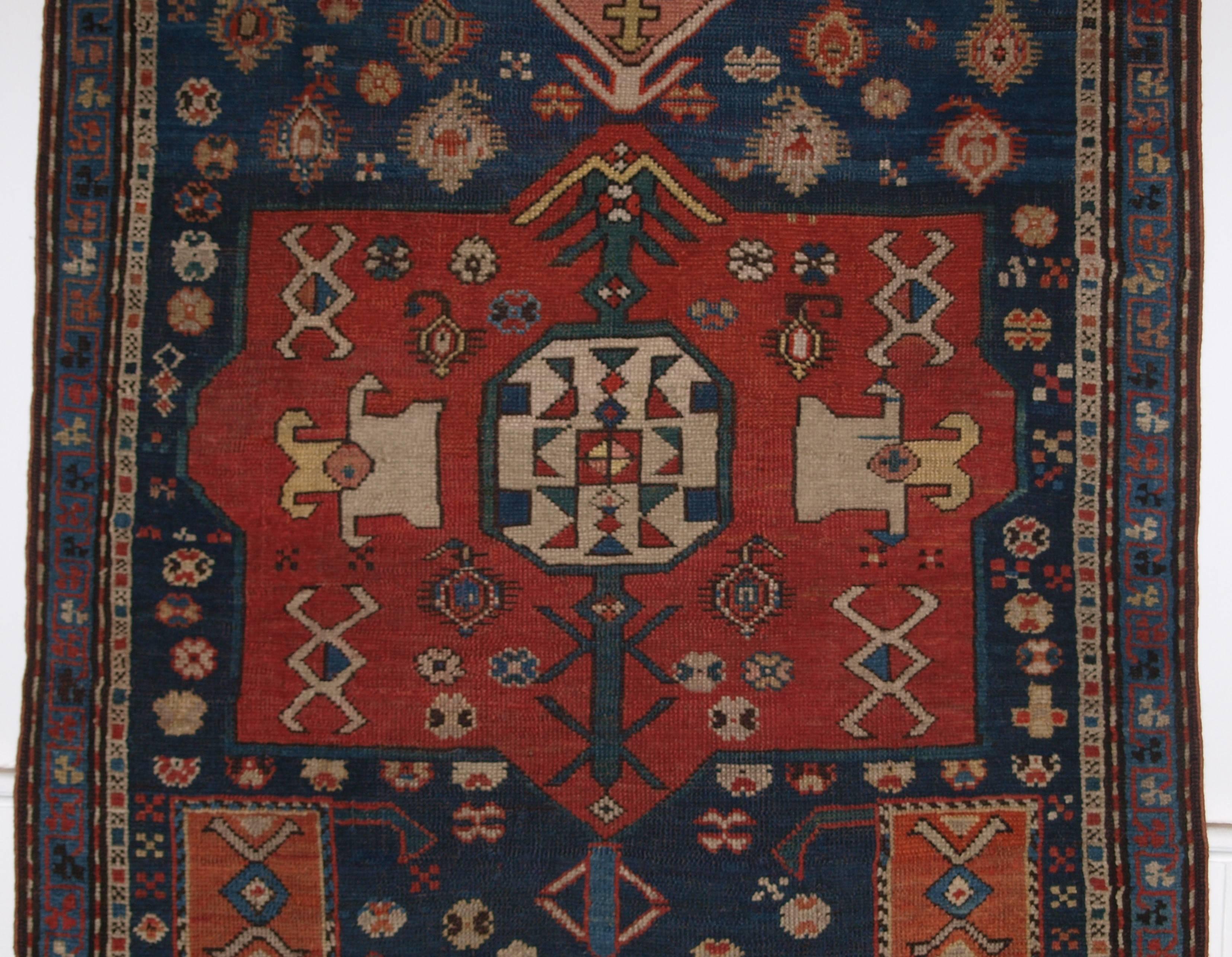 Size: 5ft 6in x 3ft 4in (167 x 101cm).

Antique Caucasian prayer rug, Karabagh region of scarce design,

late 19th century.

A superb example of a Caucasian prayer rug with very unusual bold design. Large central medallion in soft madder red