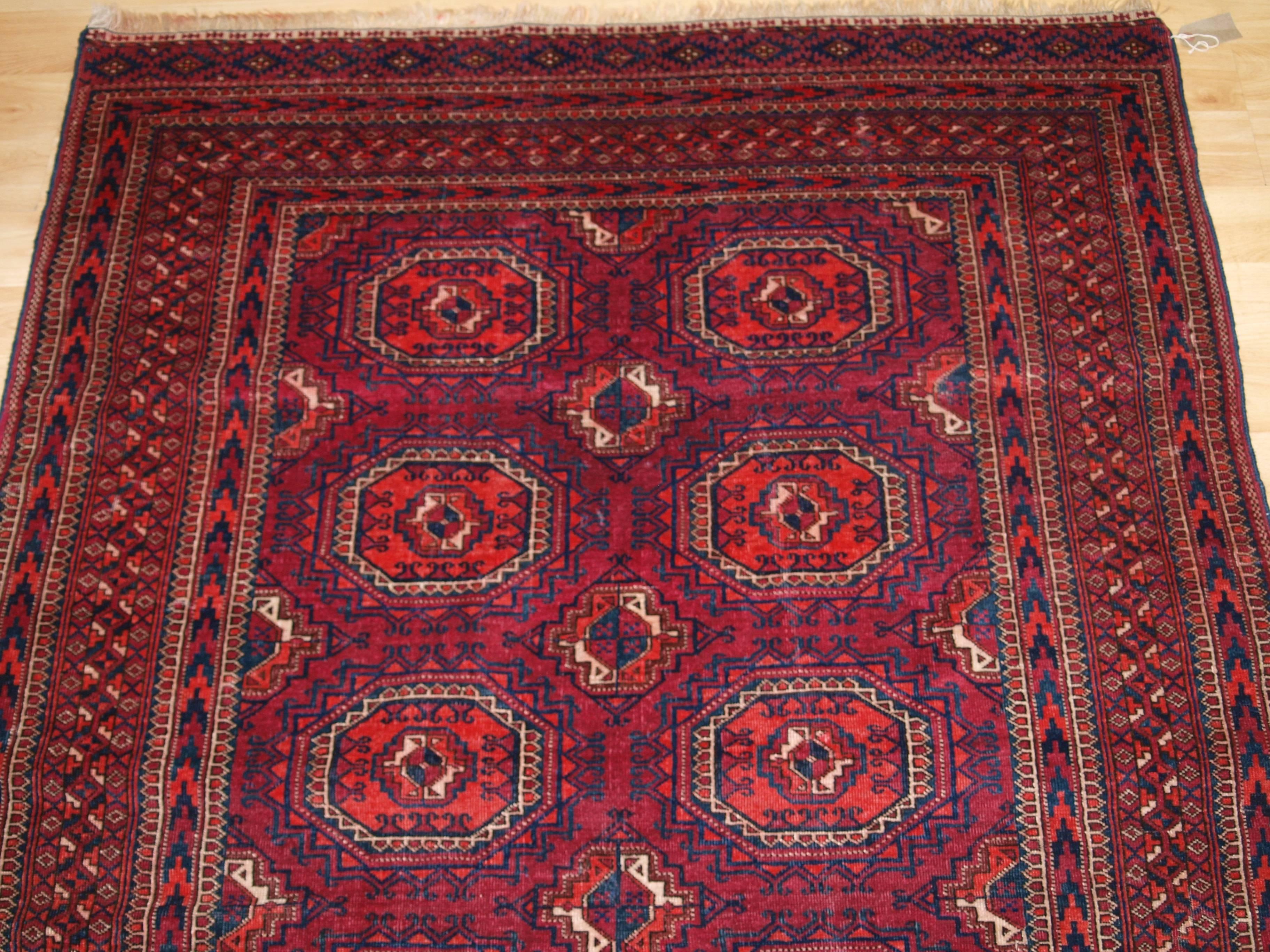 Wool Antique Tekke Turkmen Rug of Small Size, with Fine Weave, Cochineal Color For Sale