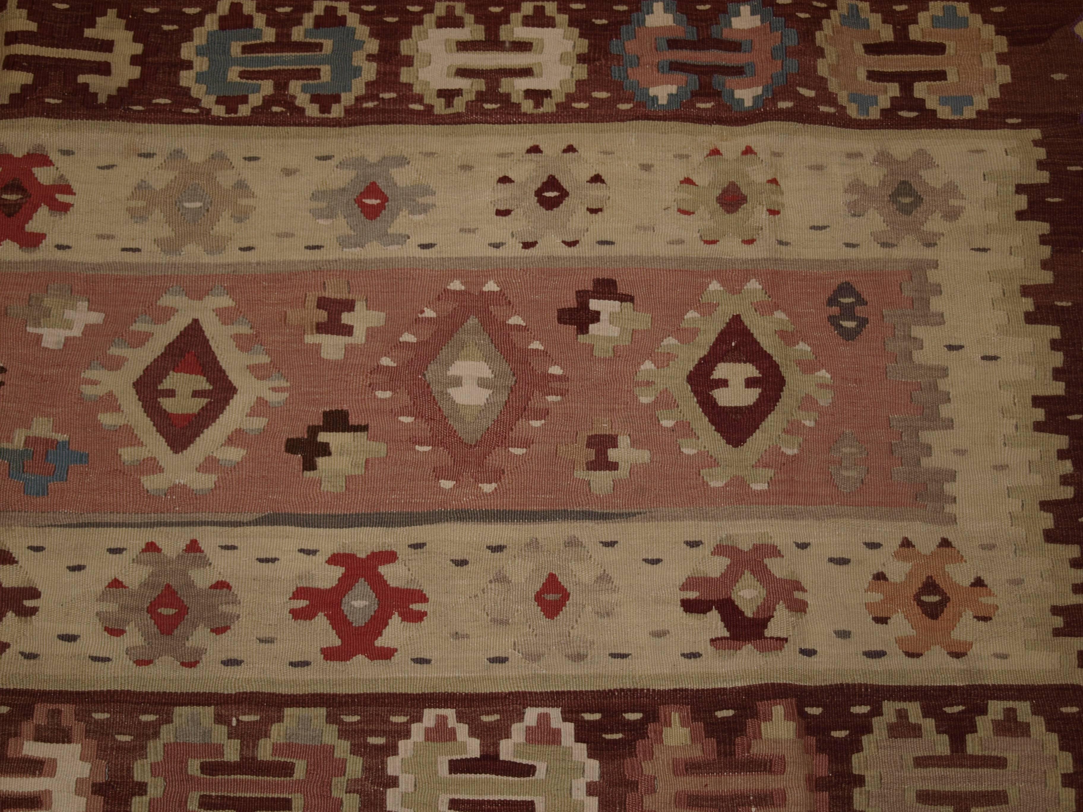 Old Turkish Sarkoy kilim rug, soft colours, banded design, square shape, circa 1920.
Size: 8ft 0in x 7ft 3in (244 x 220cm).

Old Anatolian Sharkoy Kilim, Western Turkey

circa 1920

Sharkoy kilims are also known as Sarkoy or Thracian, they