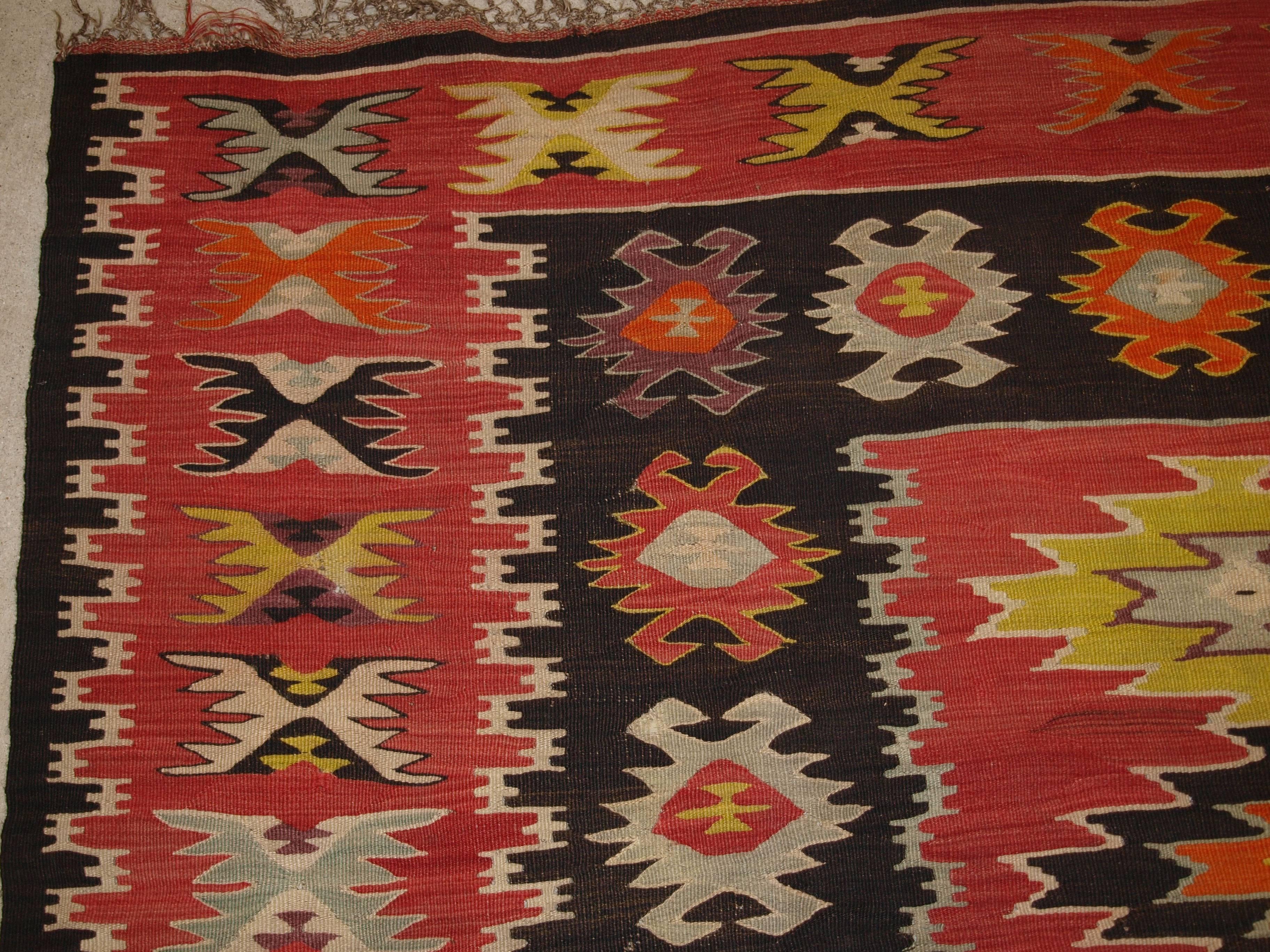 Old Turkish Sarkoy Kilim rug, soft red ground, striking design, circa 1920.
Size: 9ft 0in x 7ft 9in (275 x 235cm).

Old Anatolian Sharkoy Kilim, Western Turkey

circa 1920

Sharkoy Kilims are also known as Sarkoy or Thracian, they originate