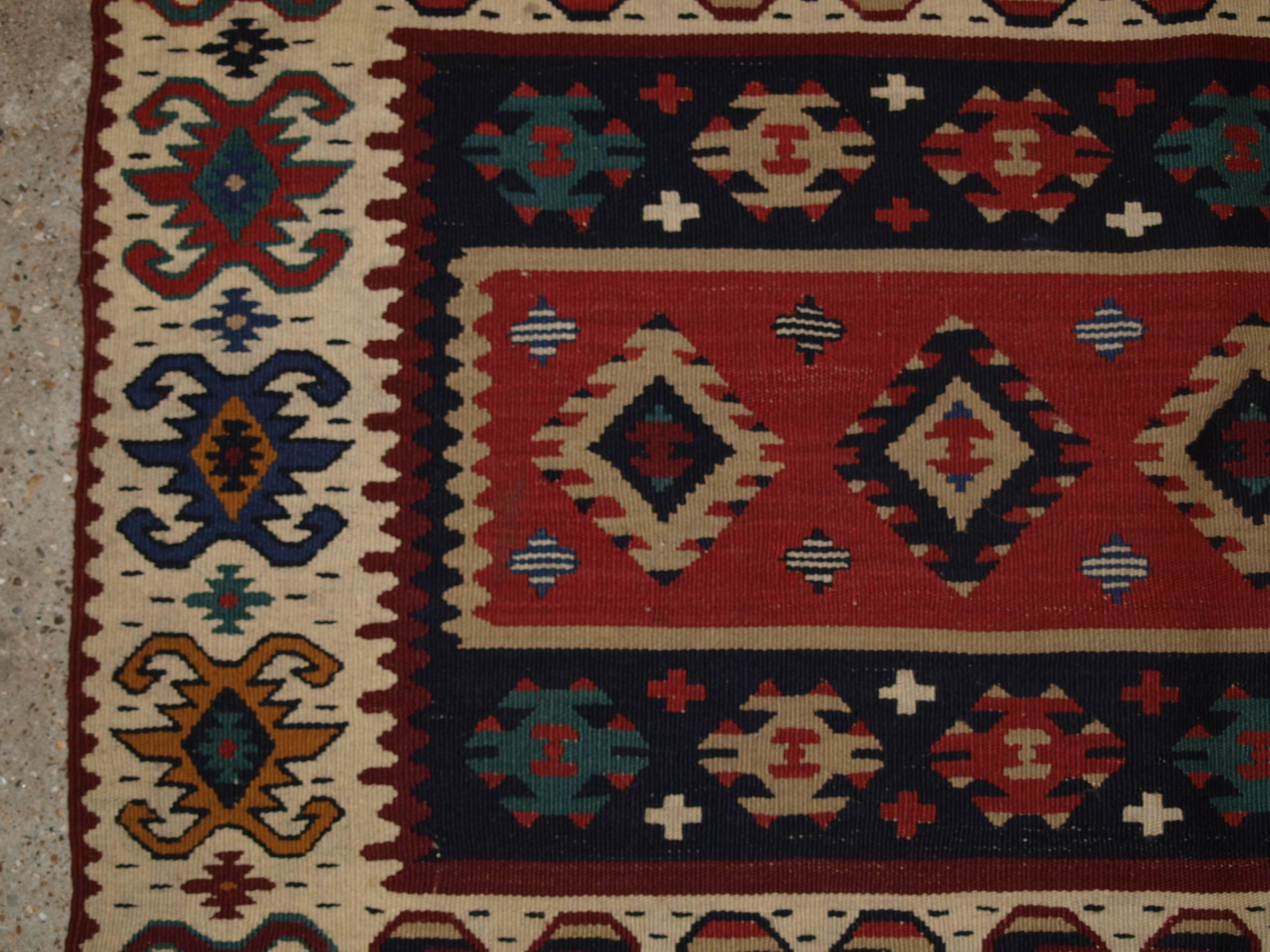 Old Turkish Sarkoy Kilim rug, ivory border, banded design, circa 1920.
Size: 6ft 8in x 4ft 2in (202 x 128cm).

Old Anatolian Sharkoy Kilim, Western Turkey

circa 1920

Sharkoy kilims are also known as Sarkoy or Thracian, they originate from