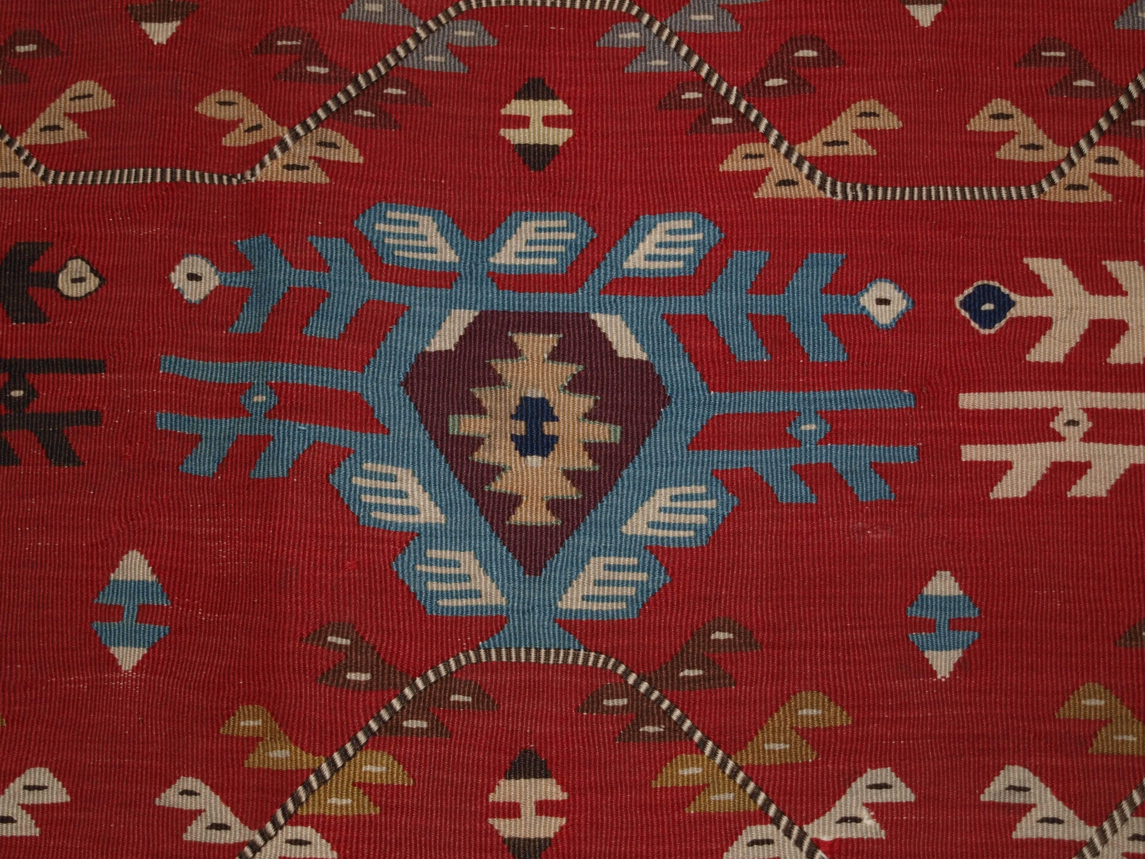 Old Turkish Sarkoy Kilim rug, unusual design on soft red ground, circa 1920.
Size: 8ft 0in x 6ft 0in (243 x 182cm).

Old Anatolian Sharkoy Kilim, Western Turkey

circa 1920

Sharkoy kilims are also known as Sarkoy or Thracian, they originate