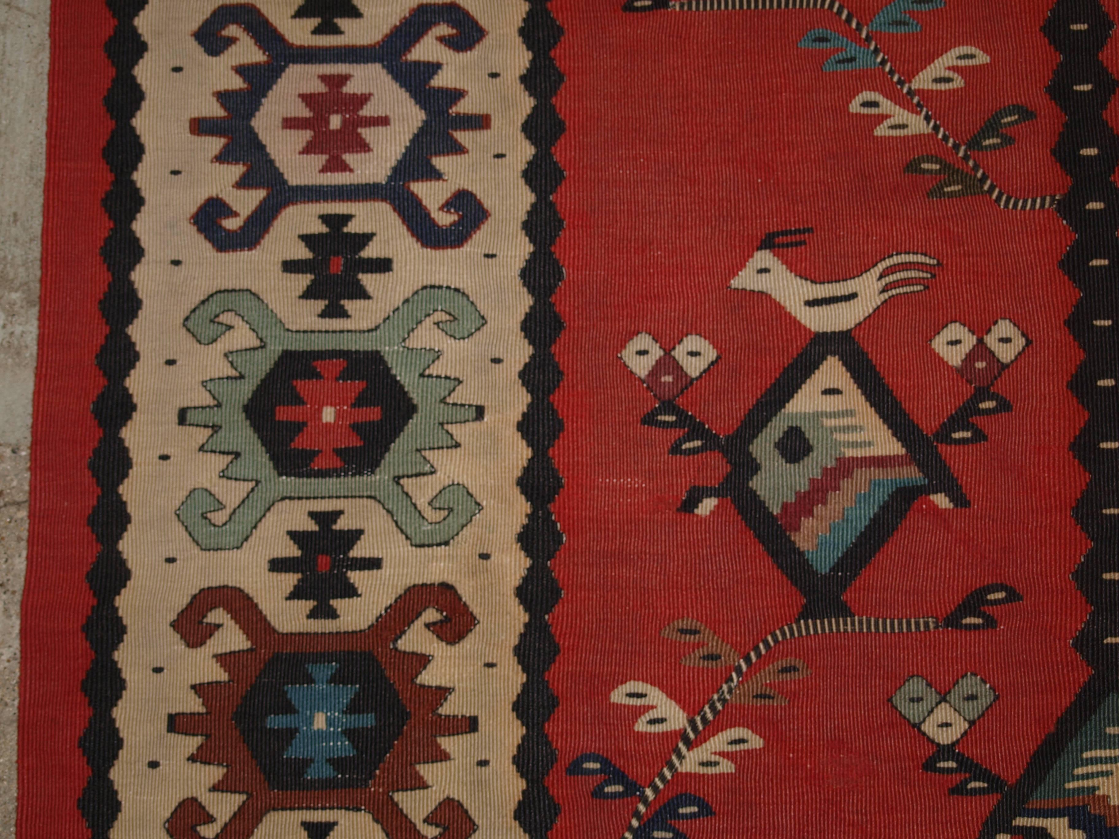 Old Turkish sarkoy kilim rug, very unusual design, circa 1920.
Size: 7ft 11in x 6ft 2in (248 x 153cm).

Old Anatolian Sharkoy kilim, Western Turkey, of very unusual design on a soft red ground,

circa 1920.

Sharkoy kilims are also known as