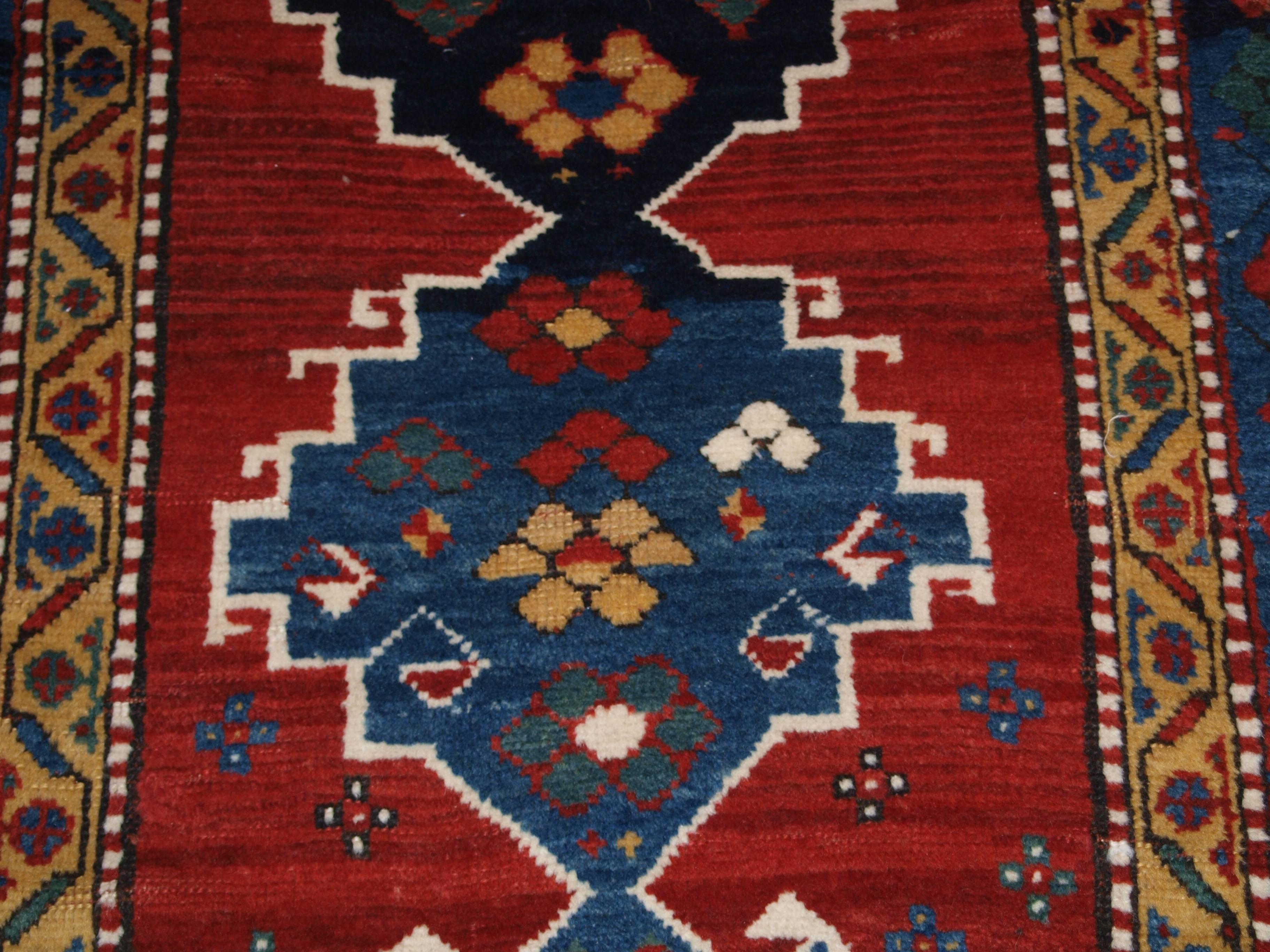 Antique Caucasian Kazak rug with superb colour and long glossy pile, late 19th century.
Size: 5ft 9in x 3ft 7in (175 x 110cm)

Antique Caucasian Kazak rug with linked medallion design.

Late 19th century

A superb Kazak rug with a single