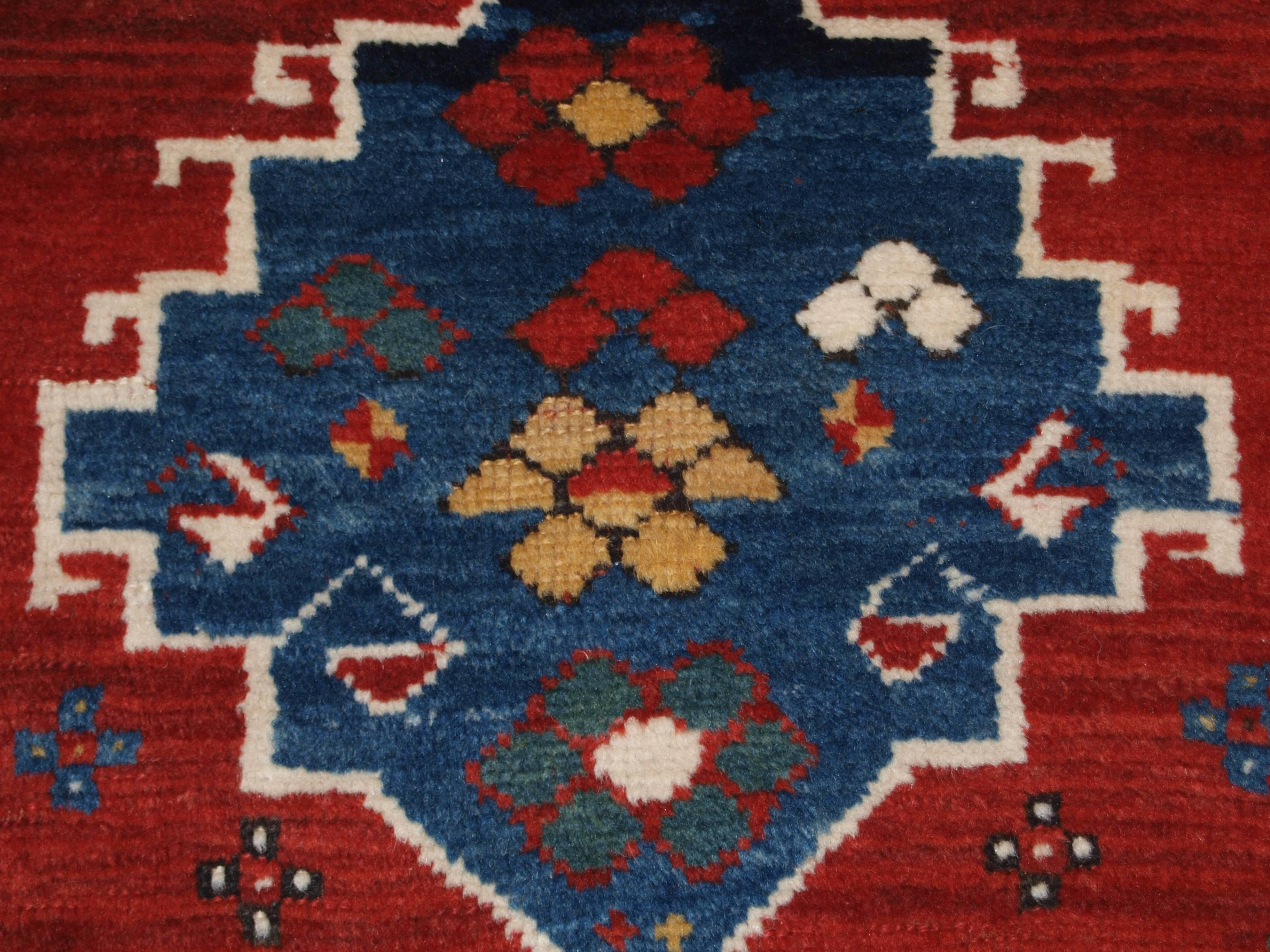 Wool Antique Caucasian Kazak Rug with Linked Medallion Design For Sale