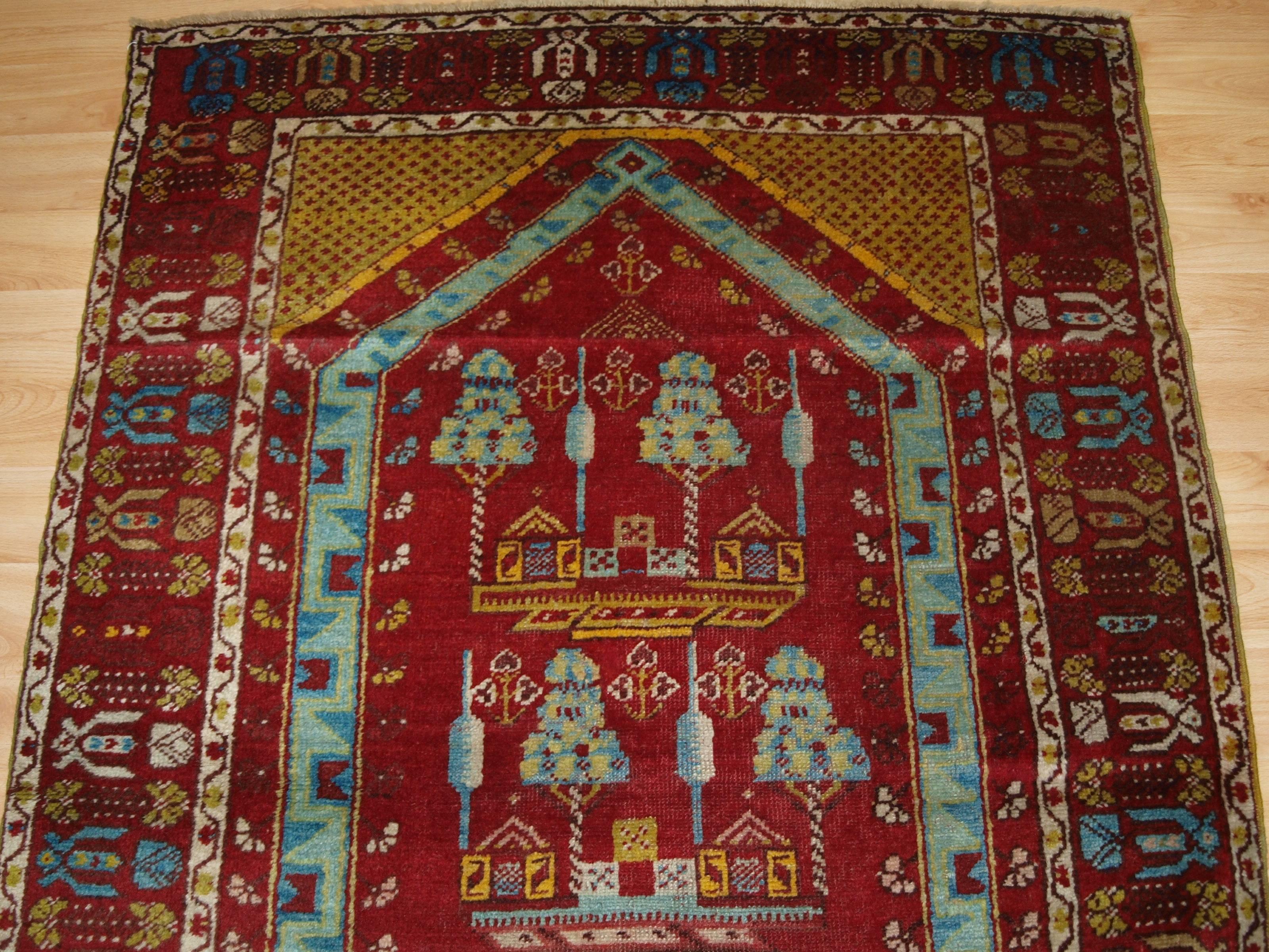 Antique Anatolian Kirsehir village prayer rug, circa 1900 (one of a pair) 1.
  

Size: 5ft 7in x 3ft 8in (171 x 112cm).

  

An interesting pictorial prayer rug with trees and villages houses. The rug is one of a pair that were woven at the