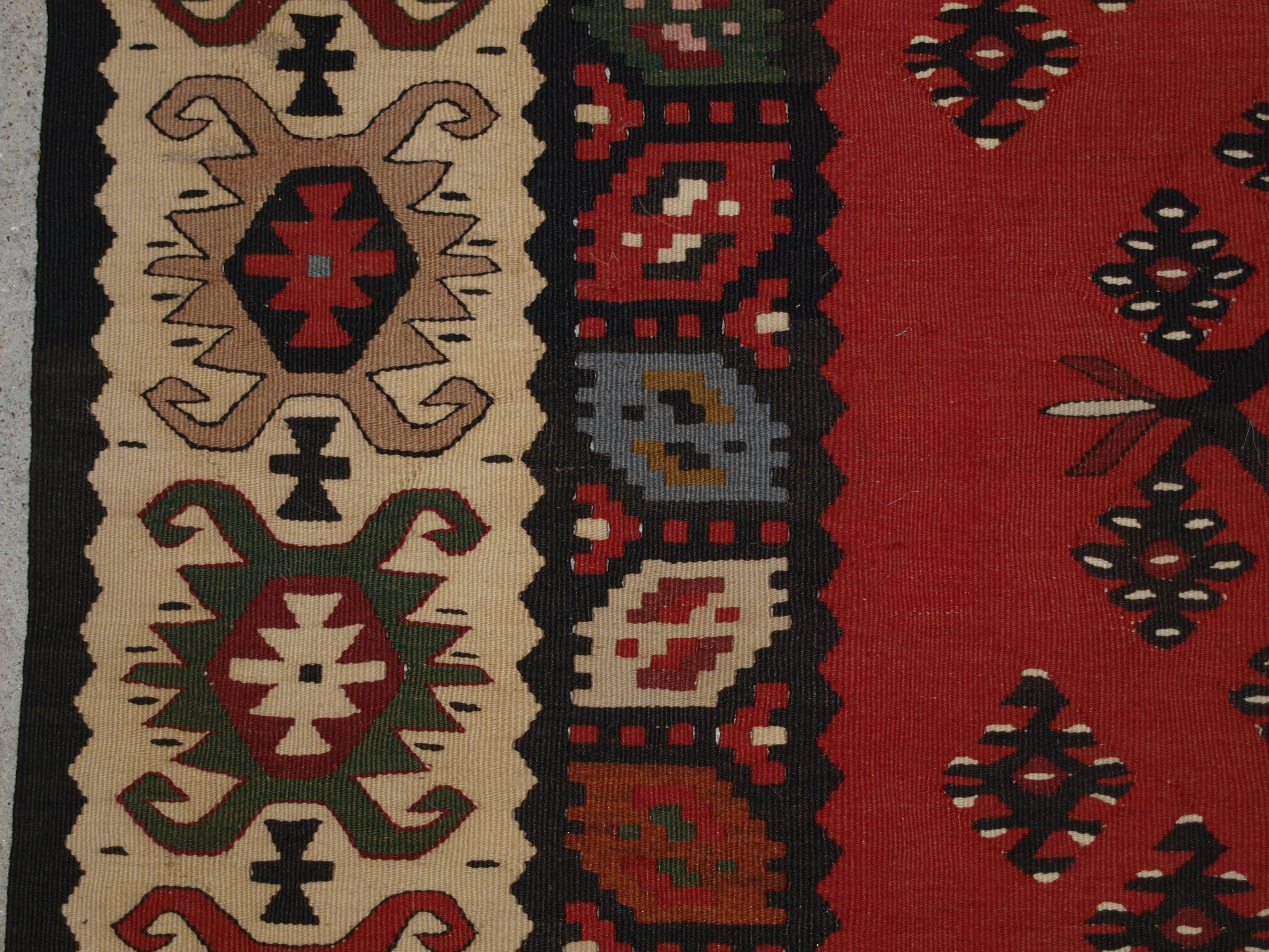 Old Turkish Sarkoy Kilim rug, traditional design on soft red ground, good ivory border, circa 1920.
Size: 8ft 10in x 4ft 6in (268 x 136cm).

Old Anatolian Sharkoy Kilim, Western Turkey of traditional design on a very soft red ground.

 