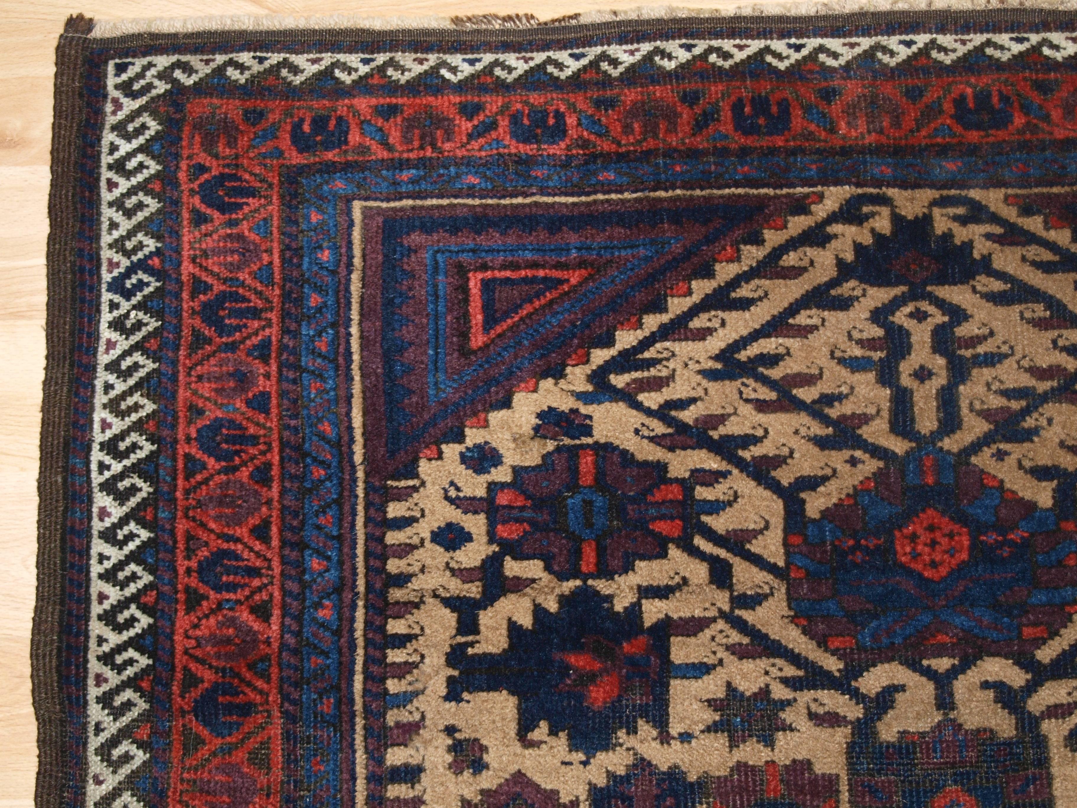 Antique baluch rug from ferdows region, camel ground, Classic design, circa 1900.
Size: 5ft 4in x 3ft 6in (162 x 107cm).

Antique Baluch rug, these Baluch rugs are known as Arab Baluch from the Ferdows region,

circa 1900.

The rug has a