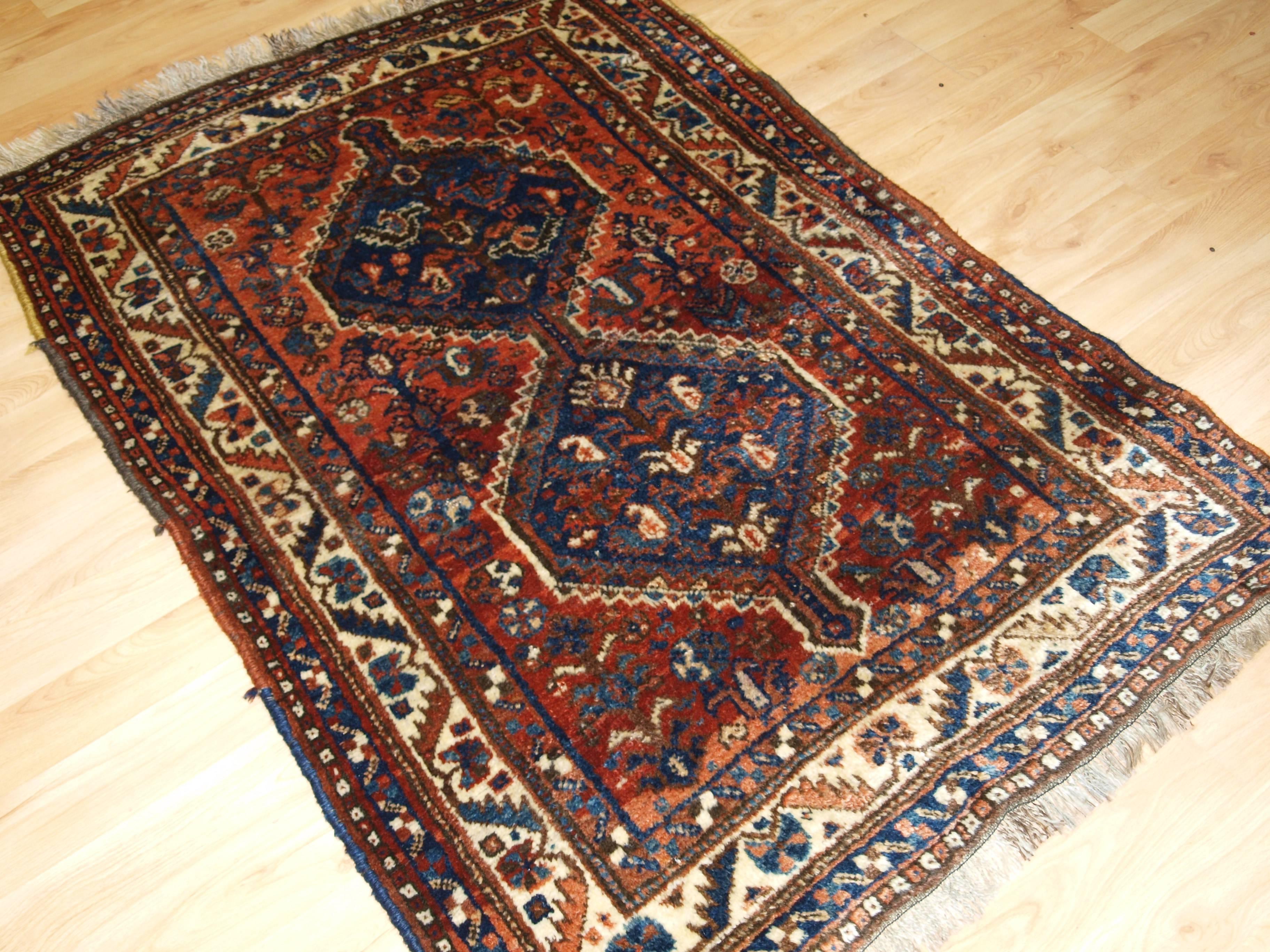 Old South West Persian Tribal rug, Shiraz region, linked medallion design, good colors, circa 1920
Size: 5ft 3in x 3ft 7in (159 x 110cm).

Old South West Persian tribal rug, Shiraz region, probably by settled weavers from the Khamseh tribe.

 